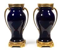 A Pair of French Gilt Bronze Mounted Cobalt Glazed Ceramic Urns Height 33 inches. — 20TH CENTURY