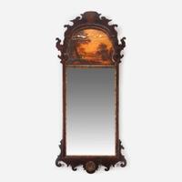 A George III fret-carved mahogany and parcel-gilt looking glass late 18th century