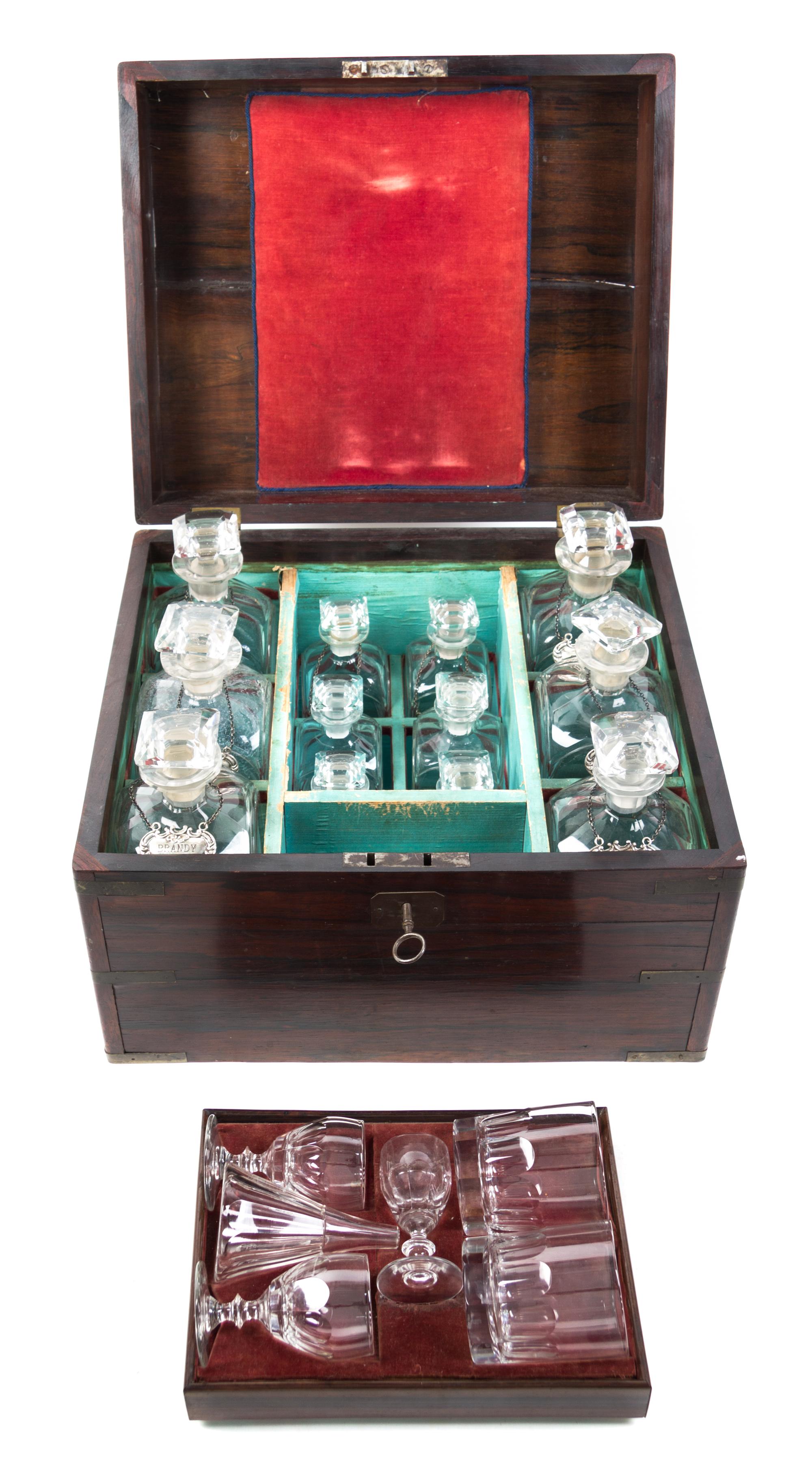 A George III Style Brass Banded Mahogany Campaign Decanter Set Width of cast 16 1/2 inches. — 19TH CENTURY
