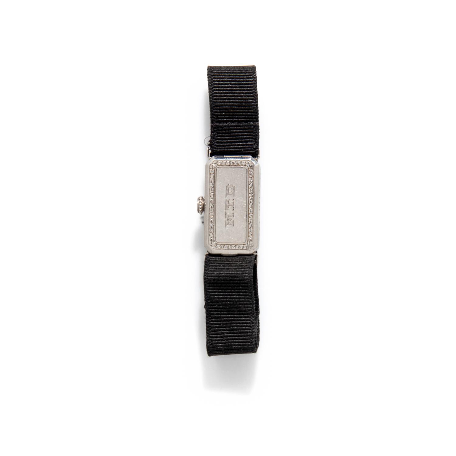 J.E. CALDWELL, PLATINUM, RUBY, AND DIAMOND WATCH