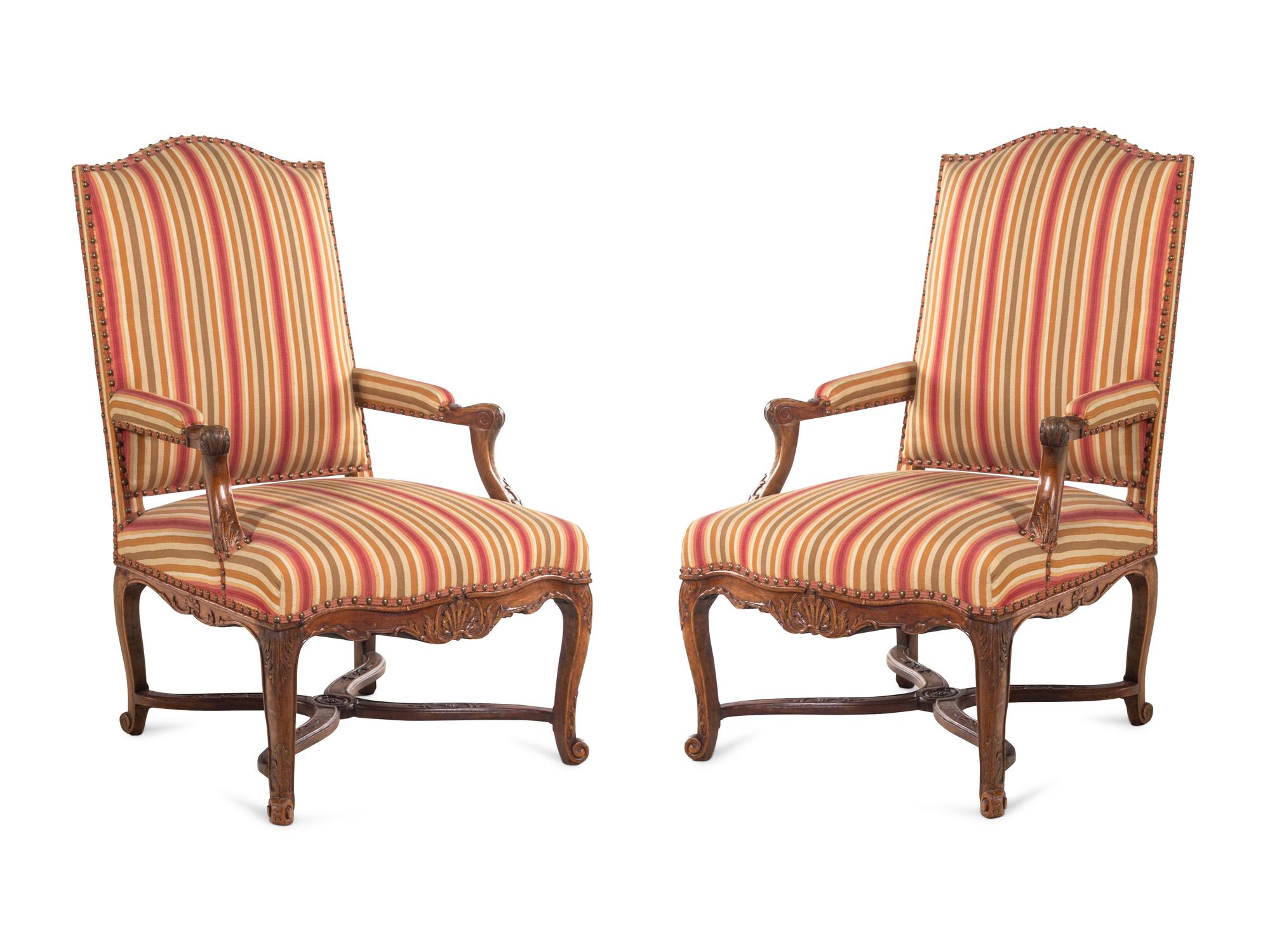 A Pair of Régence Carved Walnut Armchairs