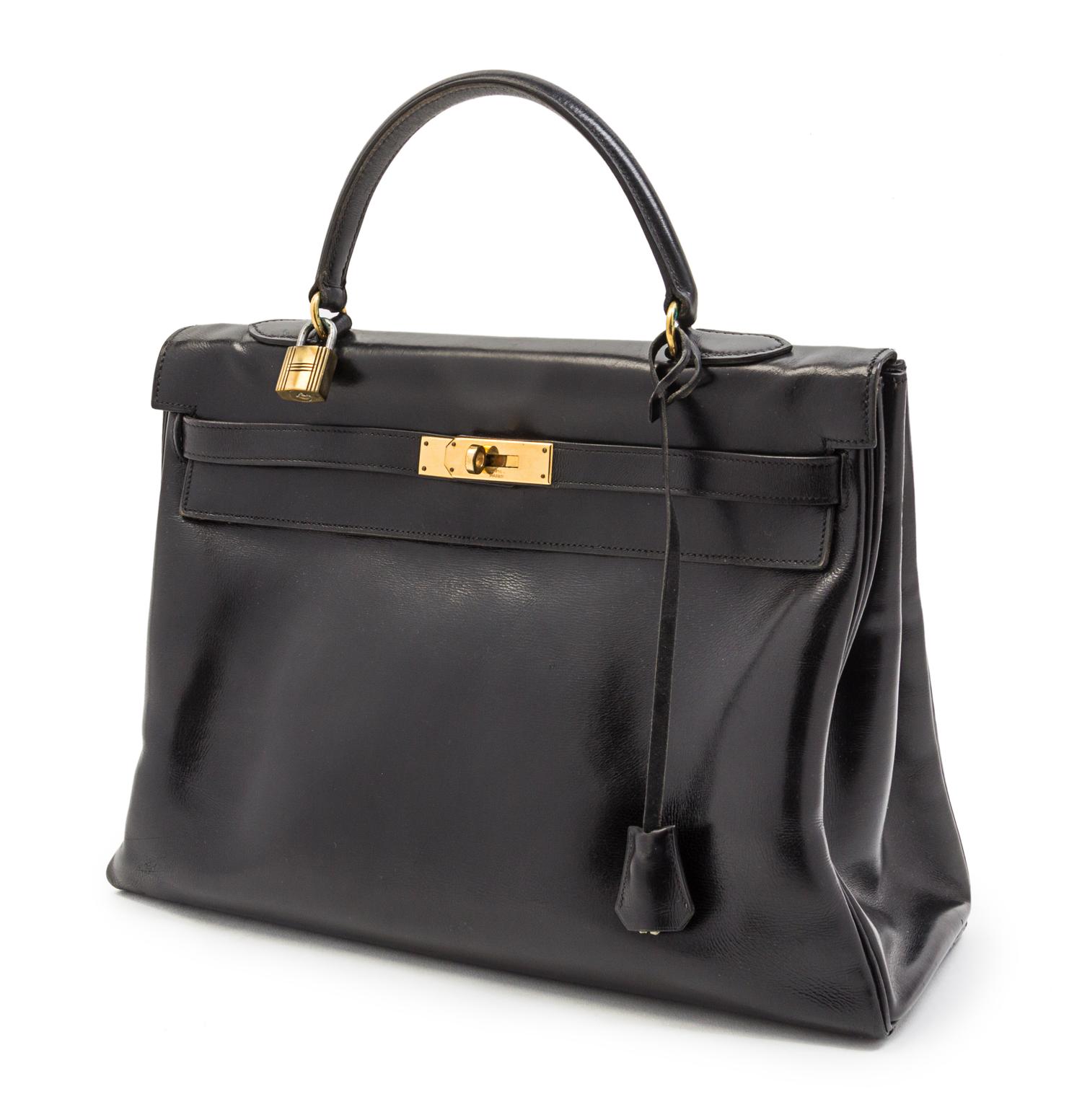 An Hermes 35cm Black Leather Kelly Bag, 13 1/2 x 9 1/2 x 5 inches.