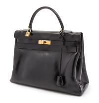 An Hermes 35cm Black Leather Kelly Bag, 13 1/2 x 9 1/2 x 5 inches.