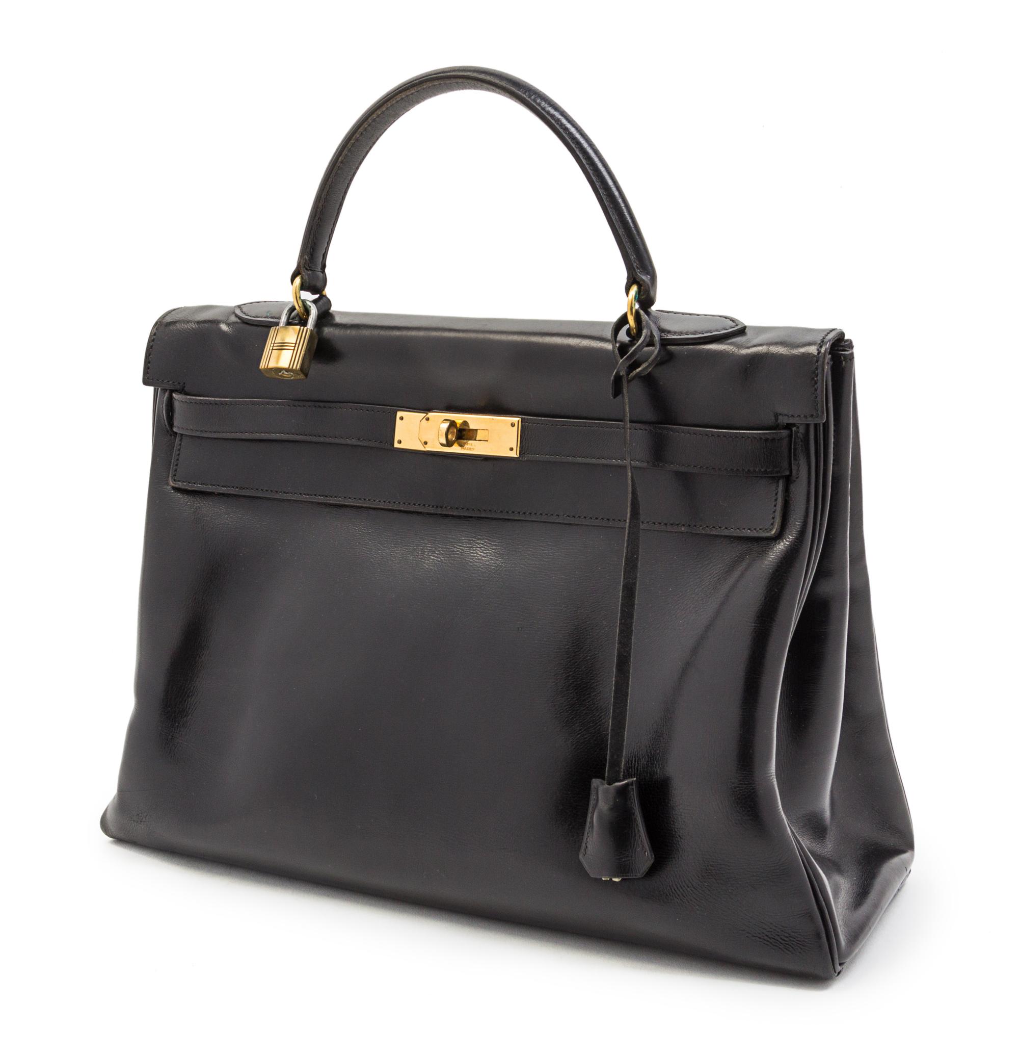 An Hermes 35cm Black Leather Kelly Bag, 13 1/2 x 9 1/2 x 5 inches.