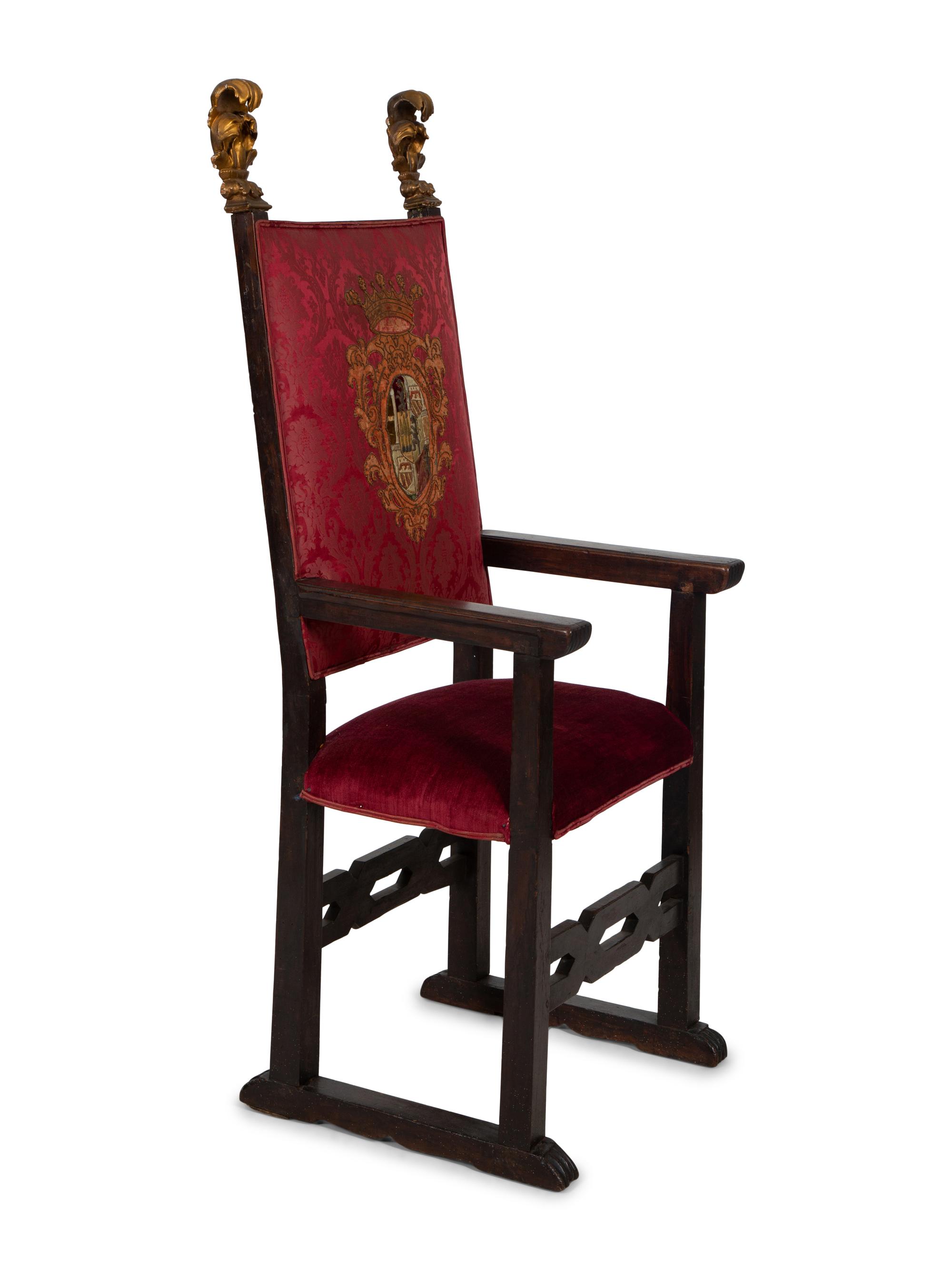 An Italian Baroque Style High Back Arm Chai r
