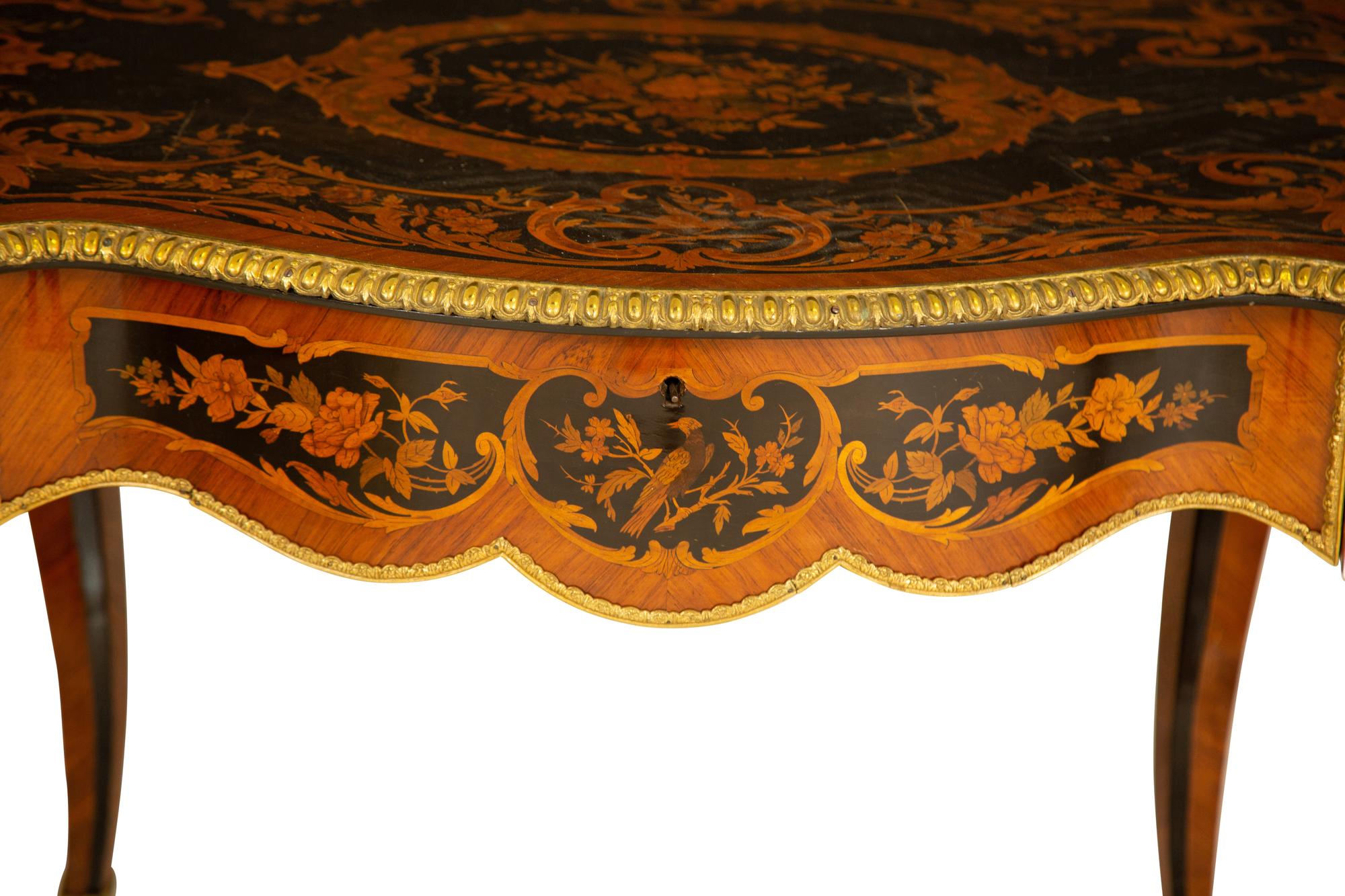 A Napoleon III Style Gilt Bronze Mounted Marquetry Center Table