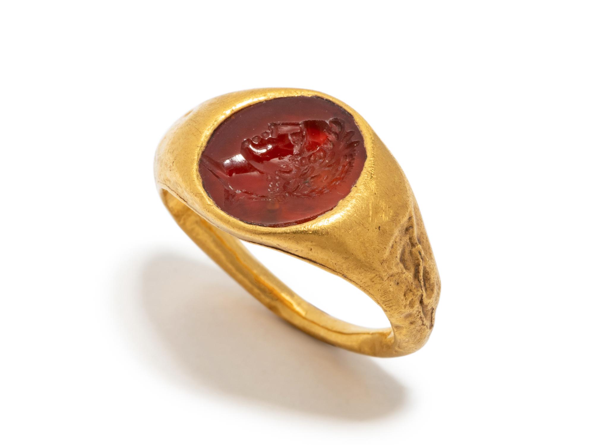 A Roman Gold and Carnelian Finger Ring with the Portrait Head of a Youth, Possibly Phoebus