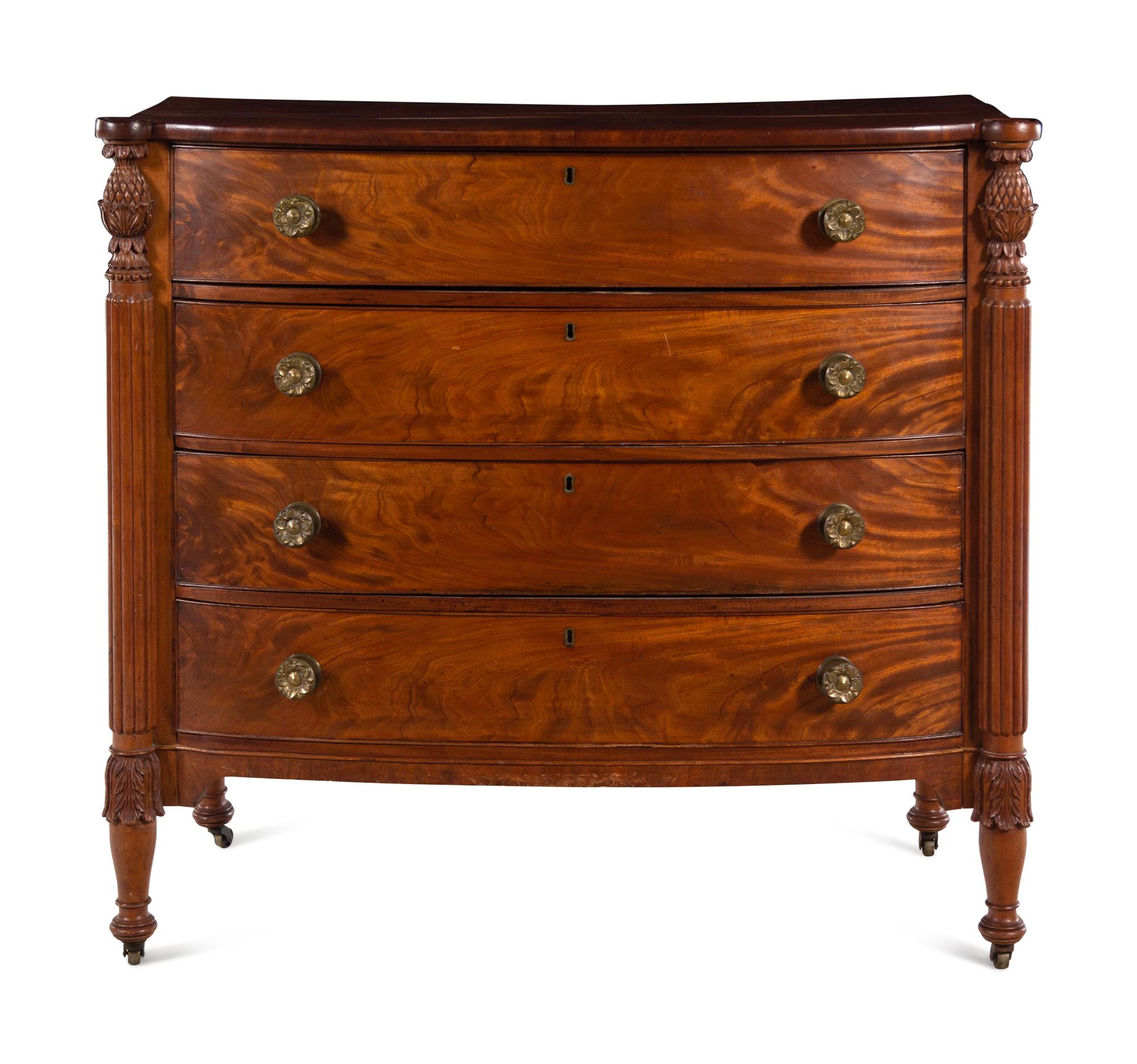 A Federal Carved and Figured Mahogany Bow-Front Chest of Drawers
