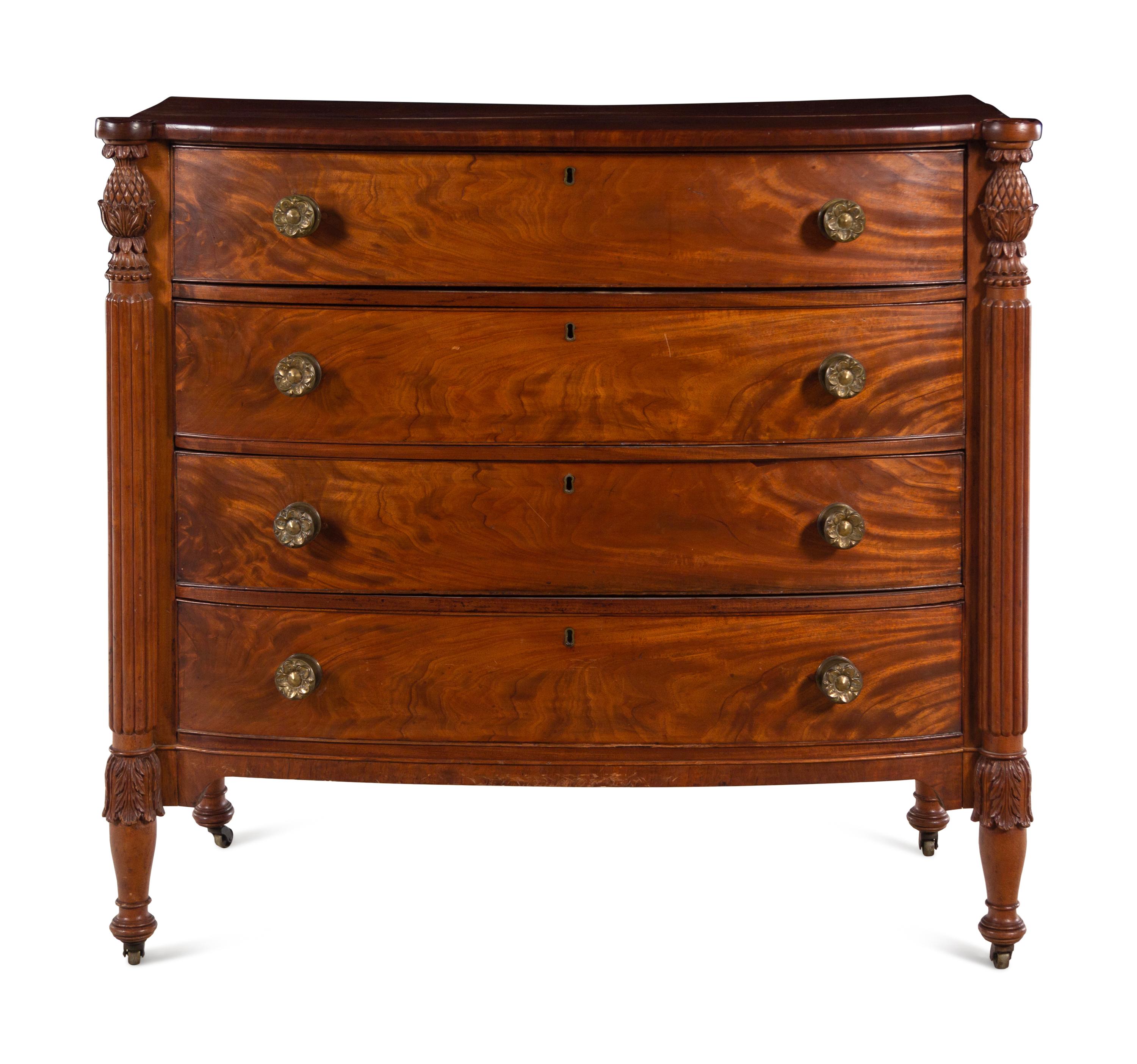A Federal Carved and Figured Mahogany Bow-Front Chest of Drawers