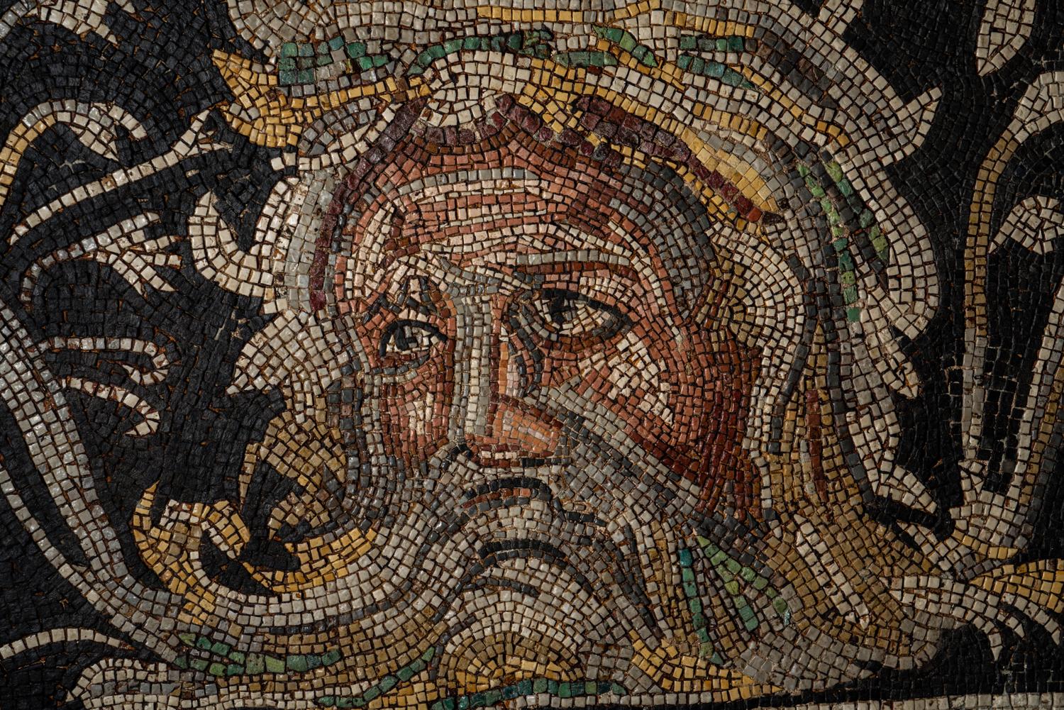 A Roman-Style Polychrome Mosaic Panel with a Bearded Head and Two Animals