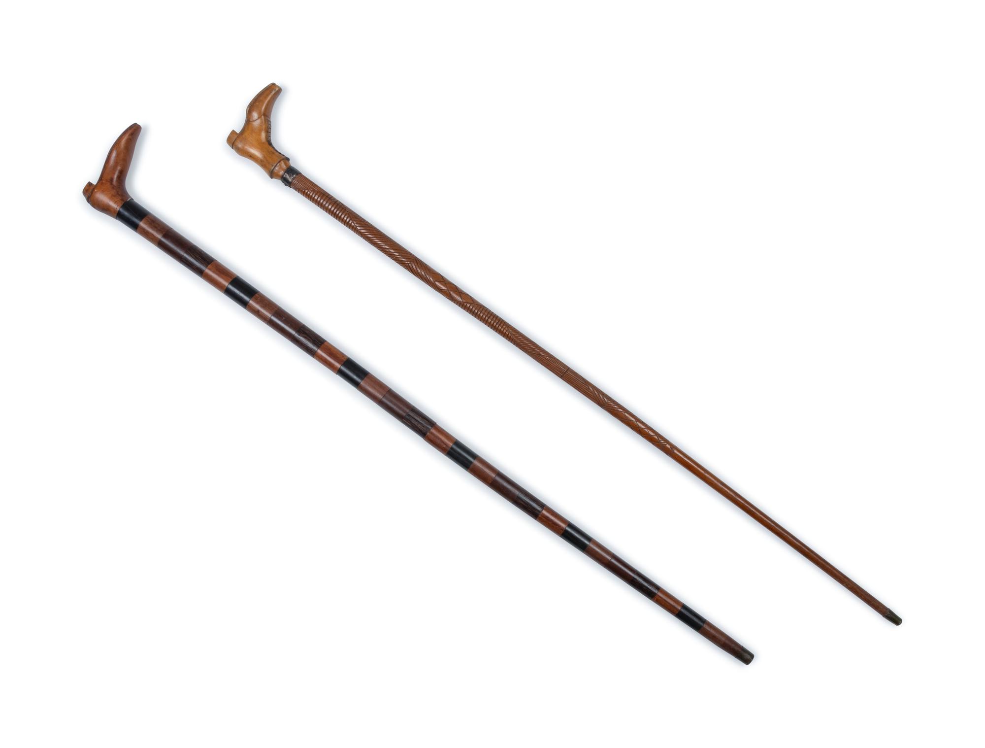 Two English Carved Wood Shoe-Form Canes