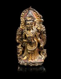 A Nepalese Gilt Copper Alloy Figure of Avalokiteshvara