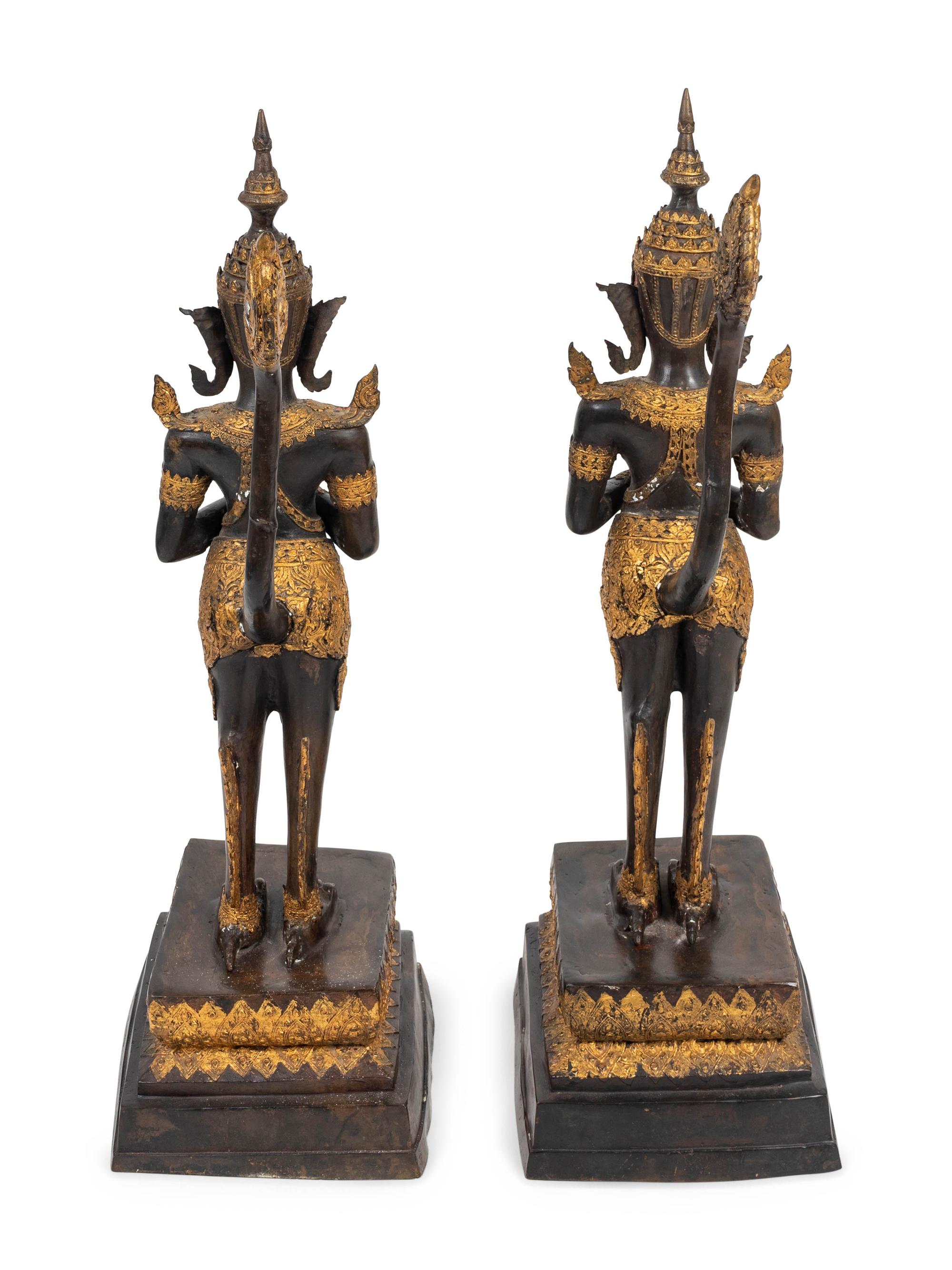 A Pair of Thai Parcel Gilt and Patinated Bronze Mythical Figures