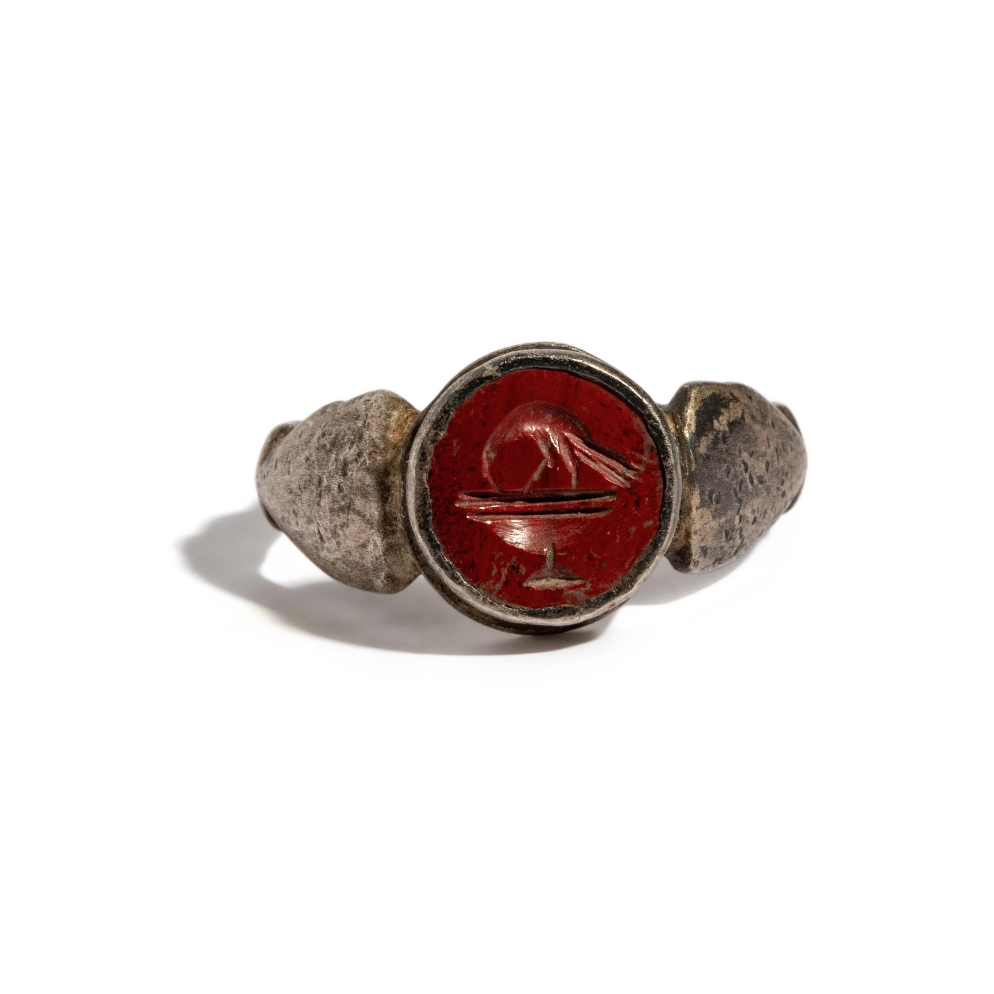 A Roman Silver and Red Jasper Finger Ring with a Bathing Bird