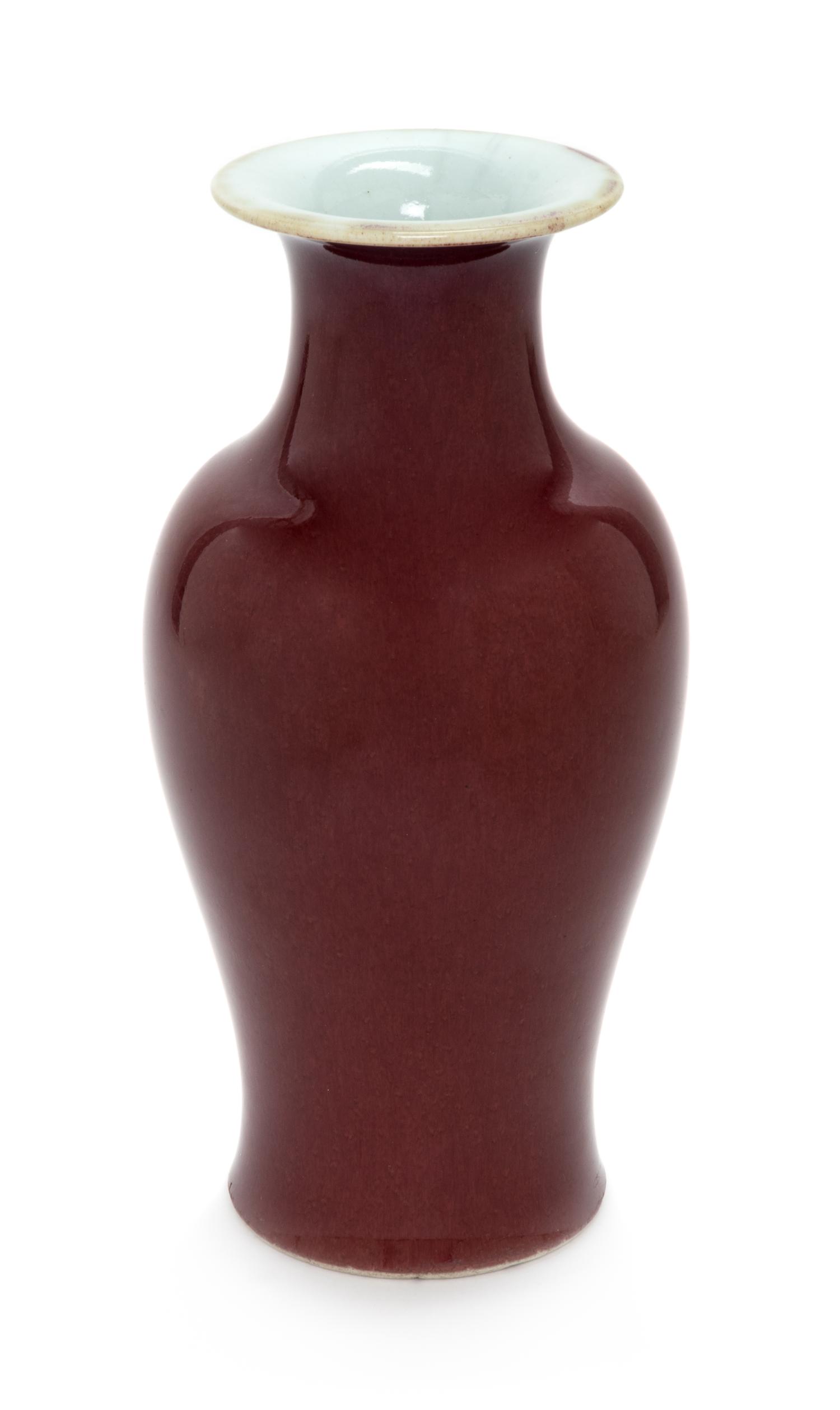 A Chinese Sang-de-Boeuf Glazed Porcelain Vase Height 9 1/2 inches. — LATE 19TH/EARLY 20TH CENTURY