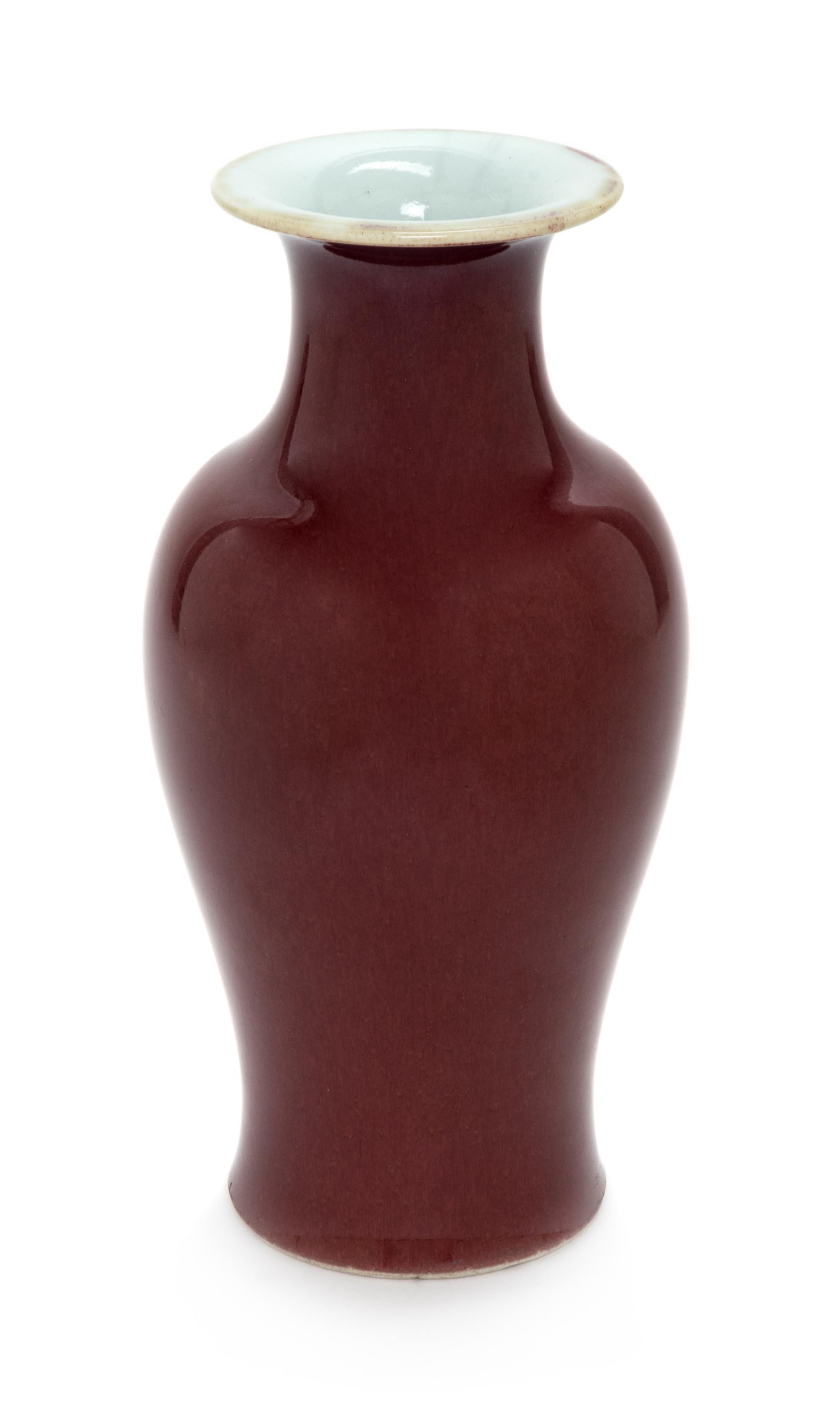 A Chinese Sang-de-Boeuf Glazed Porcelain Vase Height 9 1/2 inches. — LATE 19TH/EARLY 20TH CENTURY
