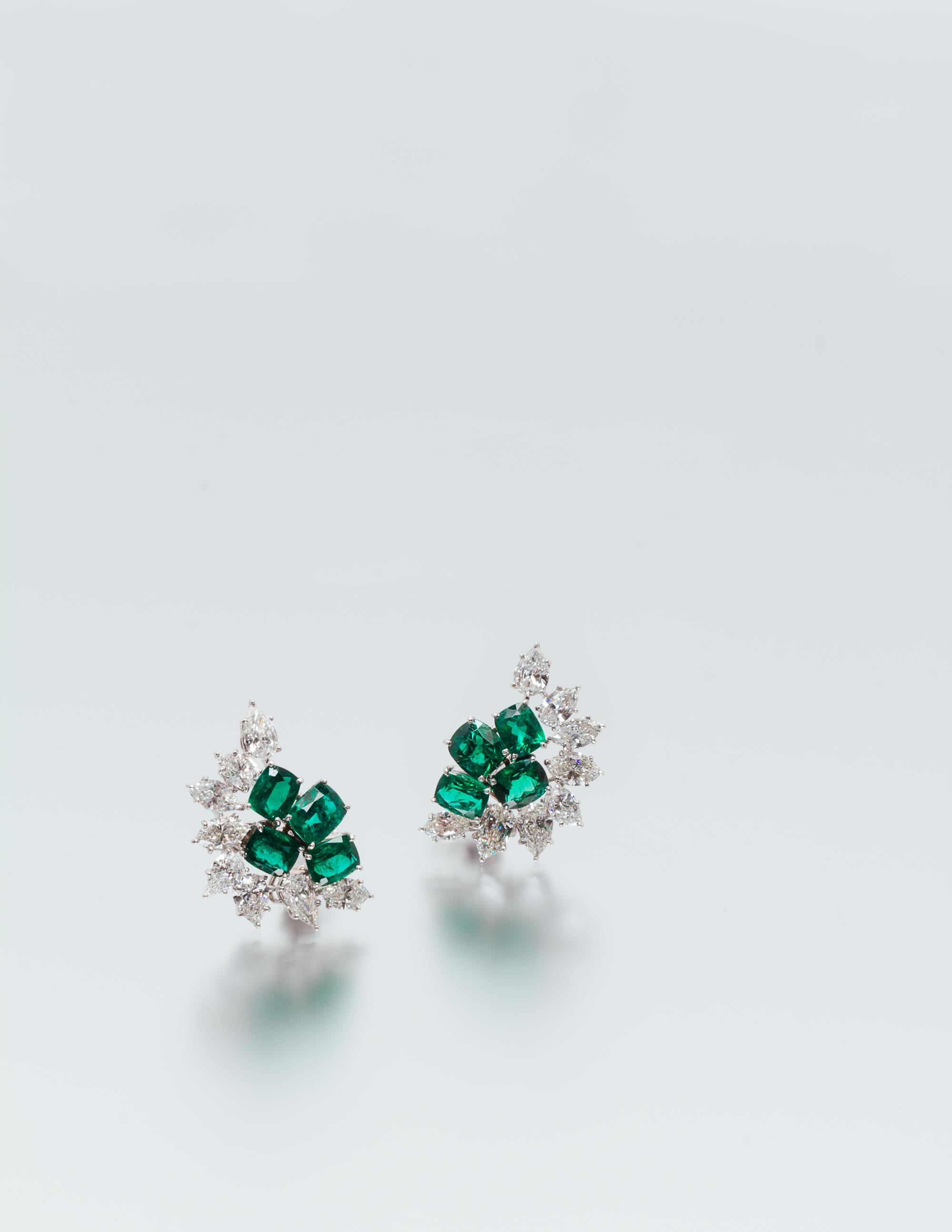 A Pair of Platinum, Emerald and Diamond Earclips, 10.40 dwts.
