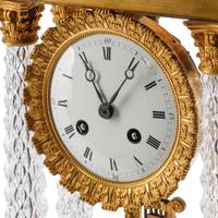A Charles X Gilt Bronze and Cut Glass Mantel Clock