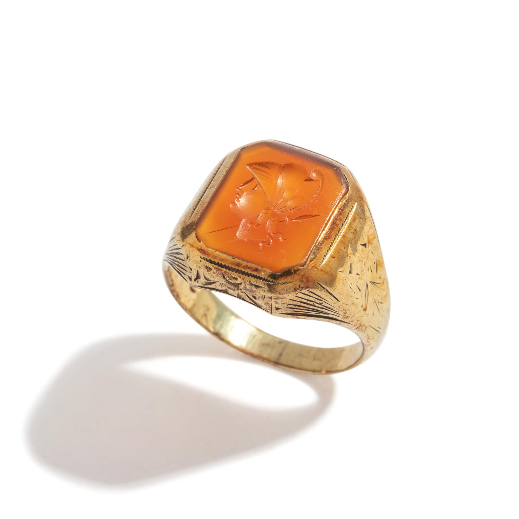 A Neoclassical Gold and Carnelian Finger Ring with the Bust of a Deity