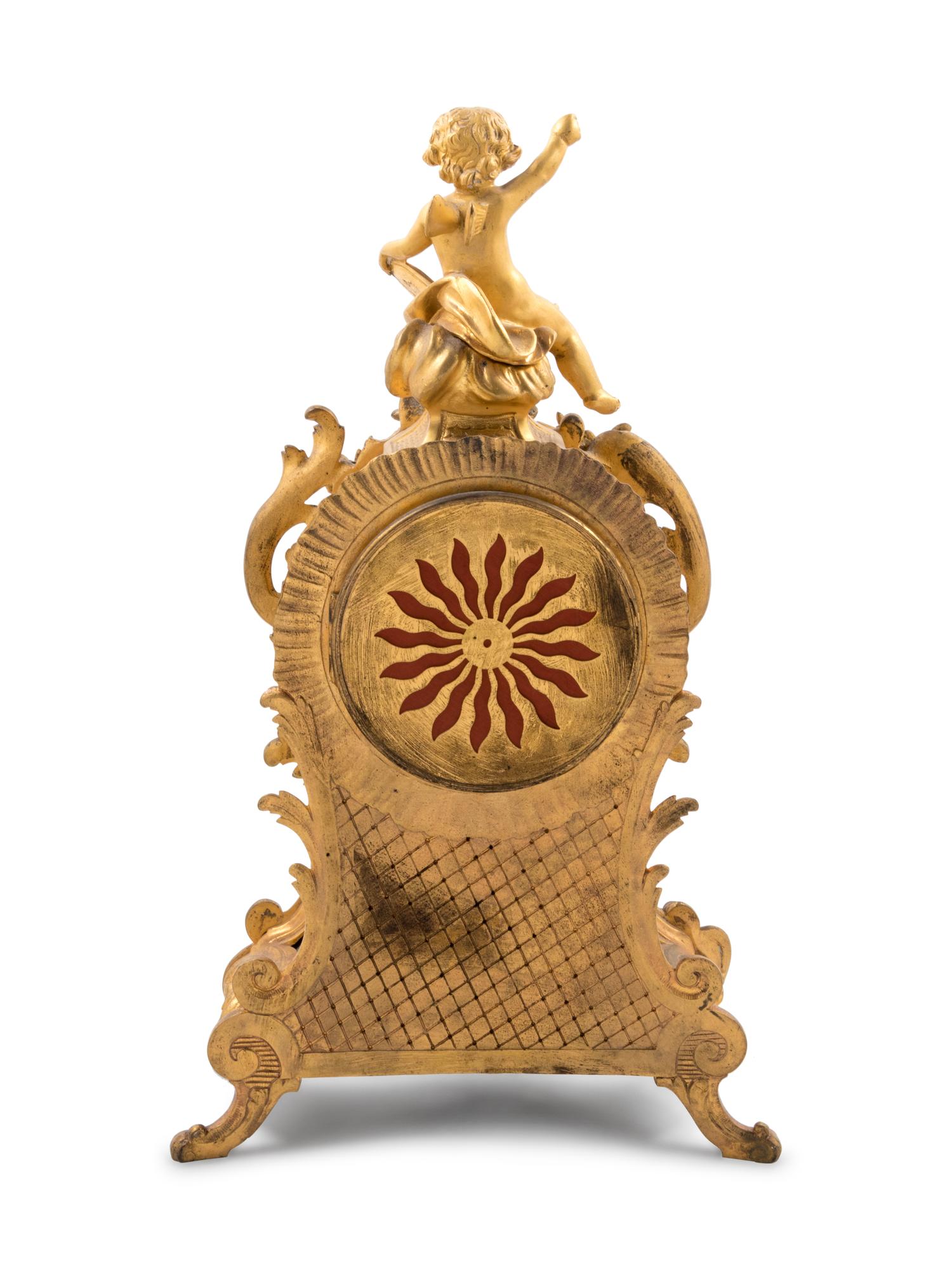A Louis XV Style Gilt Bronze and Champlevé Enamel Clock Garniture