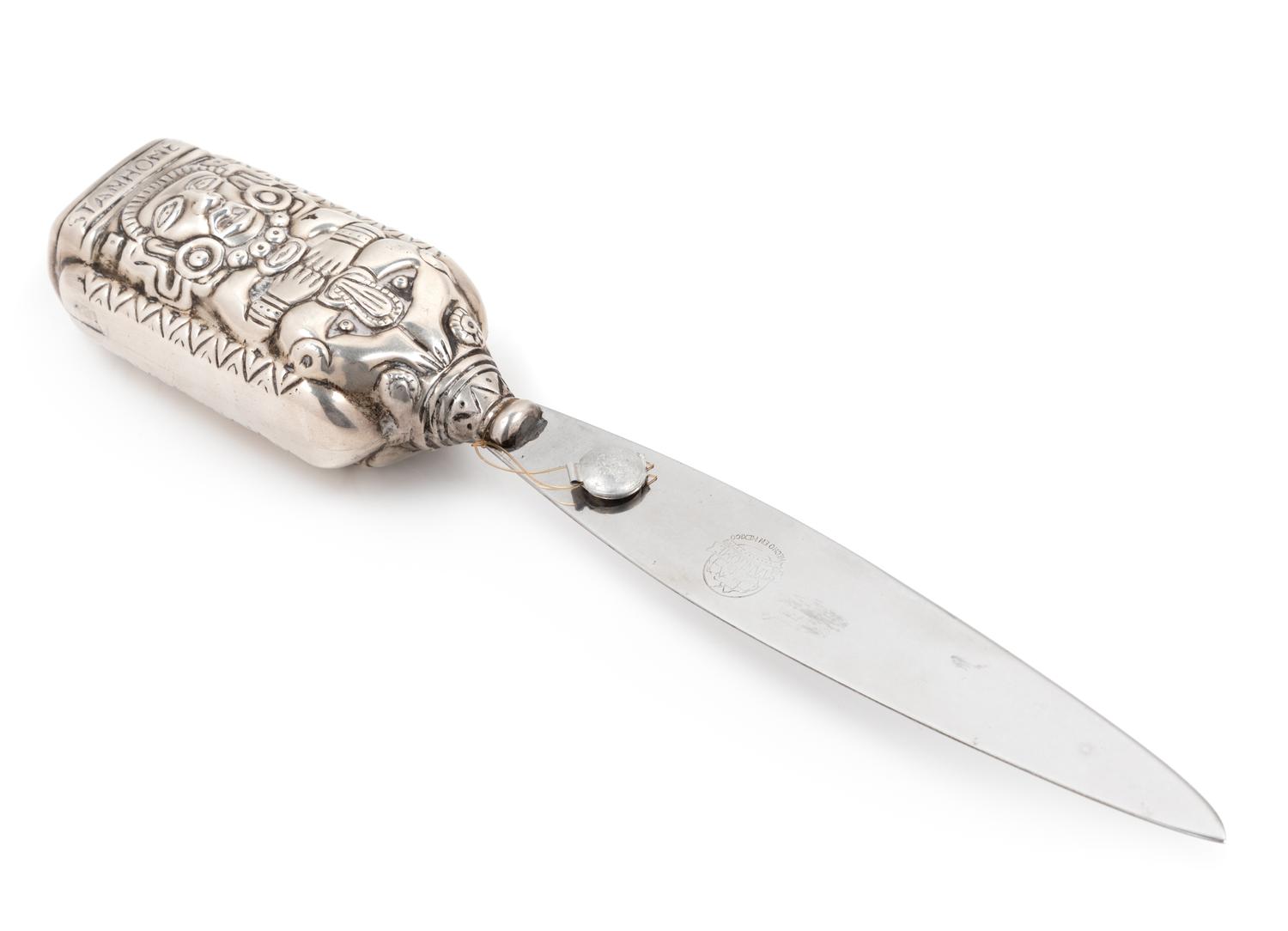 A Mexican Silver Paper Knife, Margot van Voorhies Carr, Taxco, Mid-20th Century, the handle worked with an Aztec deity, the reverse ins