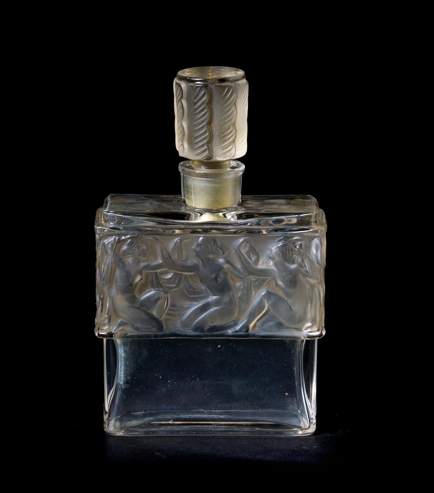 A Lalique Molded and Frosted Glass Perfume Bottle, for Molinard, Height 4 1/4 inches.