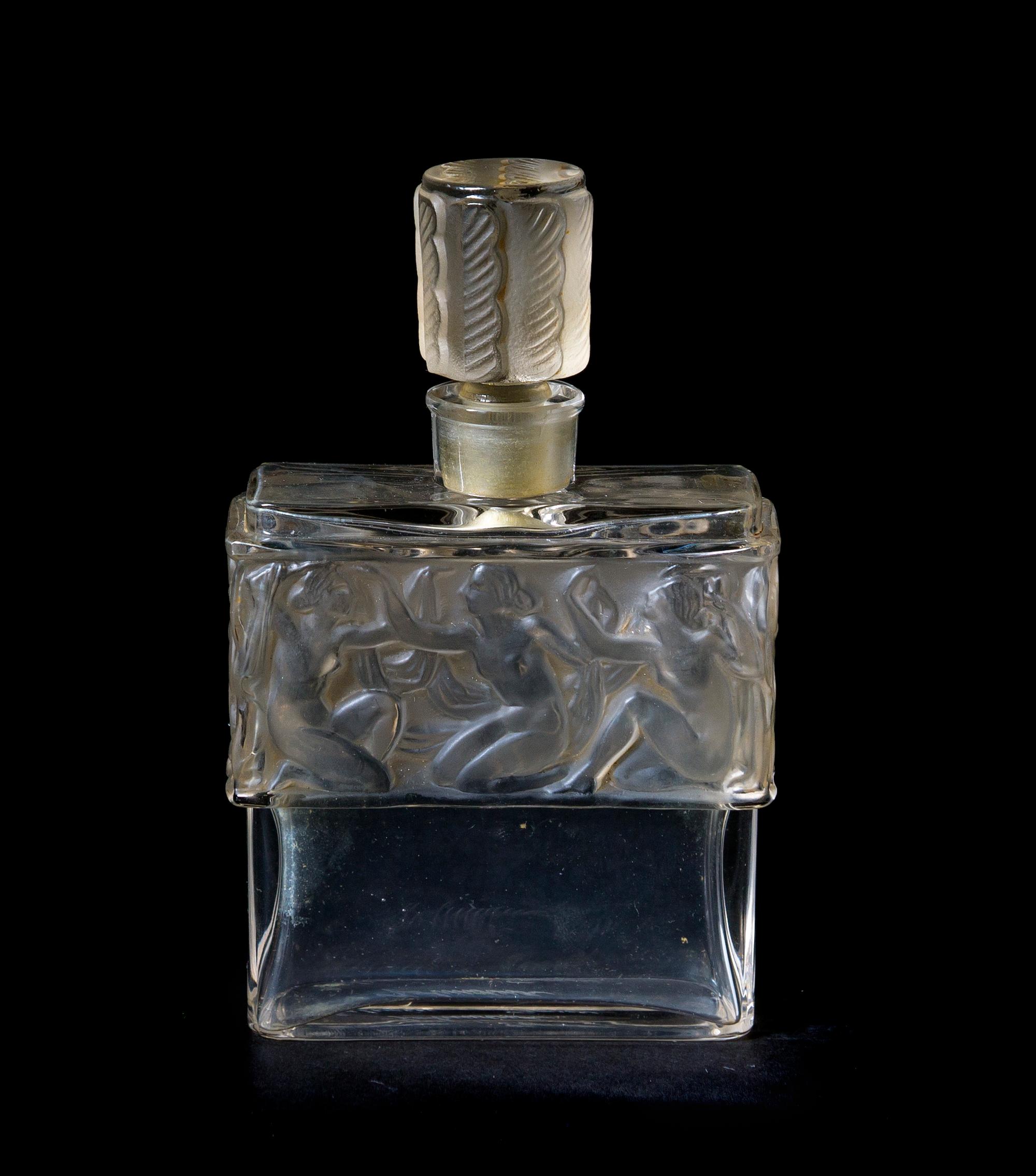 A Lalique Molded and Frosted Glass Perfume Bottle, for Molinard, Height 4 1/4 inches.