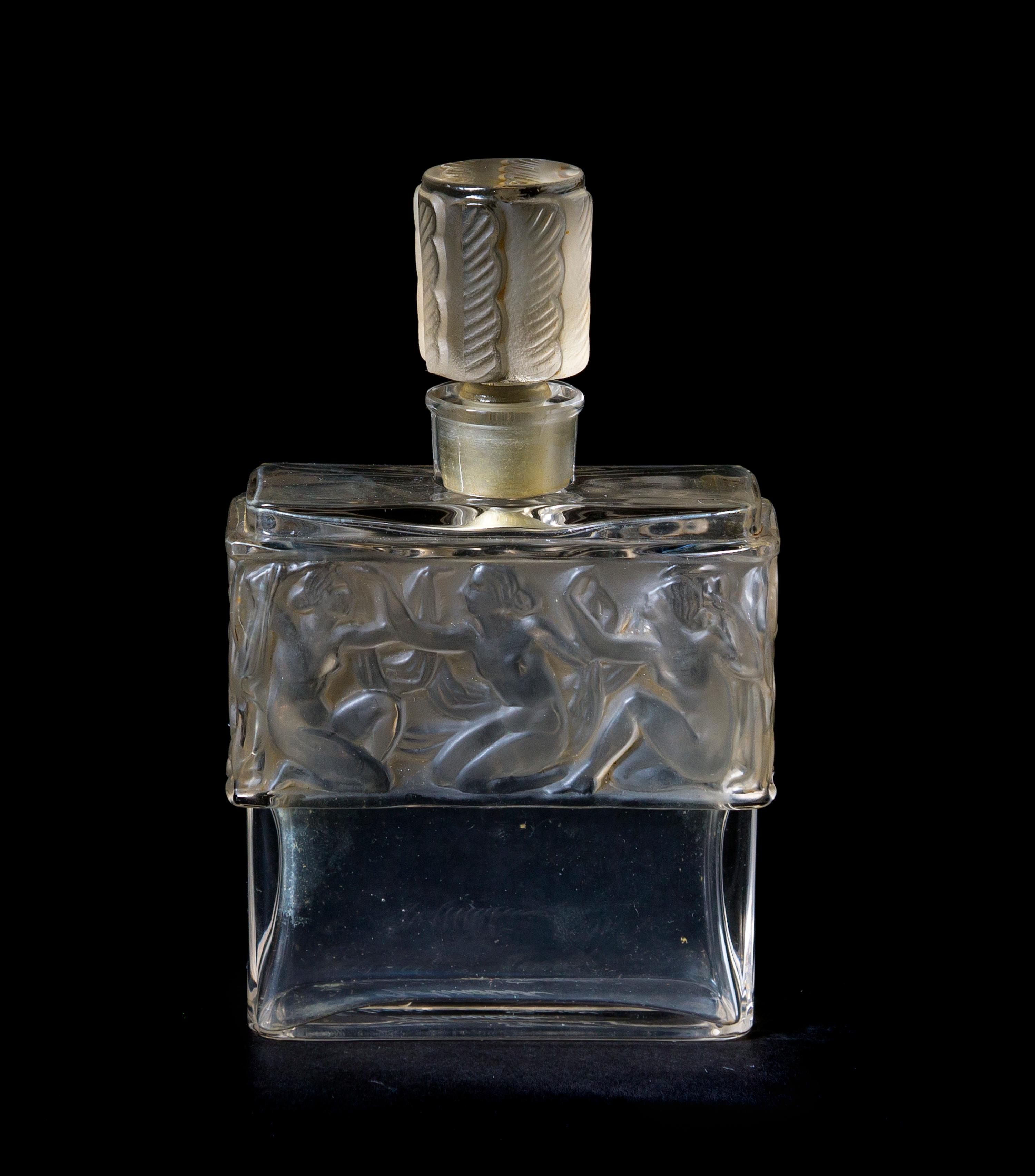 A Lalique Molded and Frosted Glass Perfume Bottle, for Molinard, Height 4 1/4 inches.