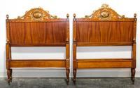A Pair of Italian Painted and Parcel Gilt Walnut Twin Beds Height 49 x width 39 1/2 x depth 82 inches. — EARLY 20TH CENTURY