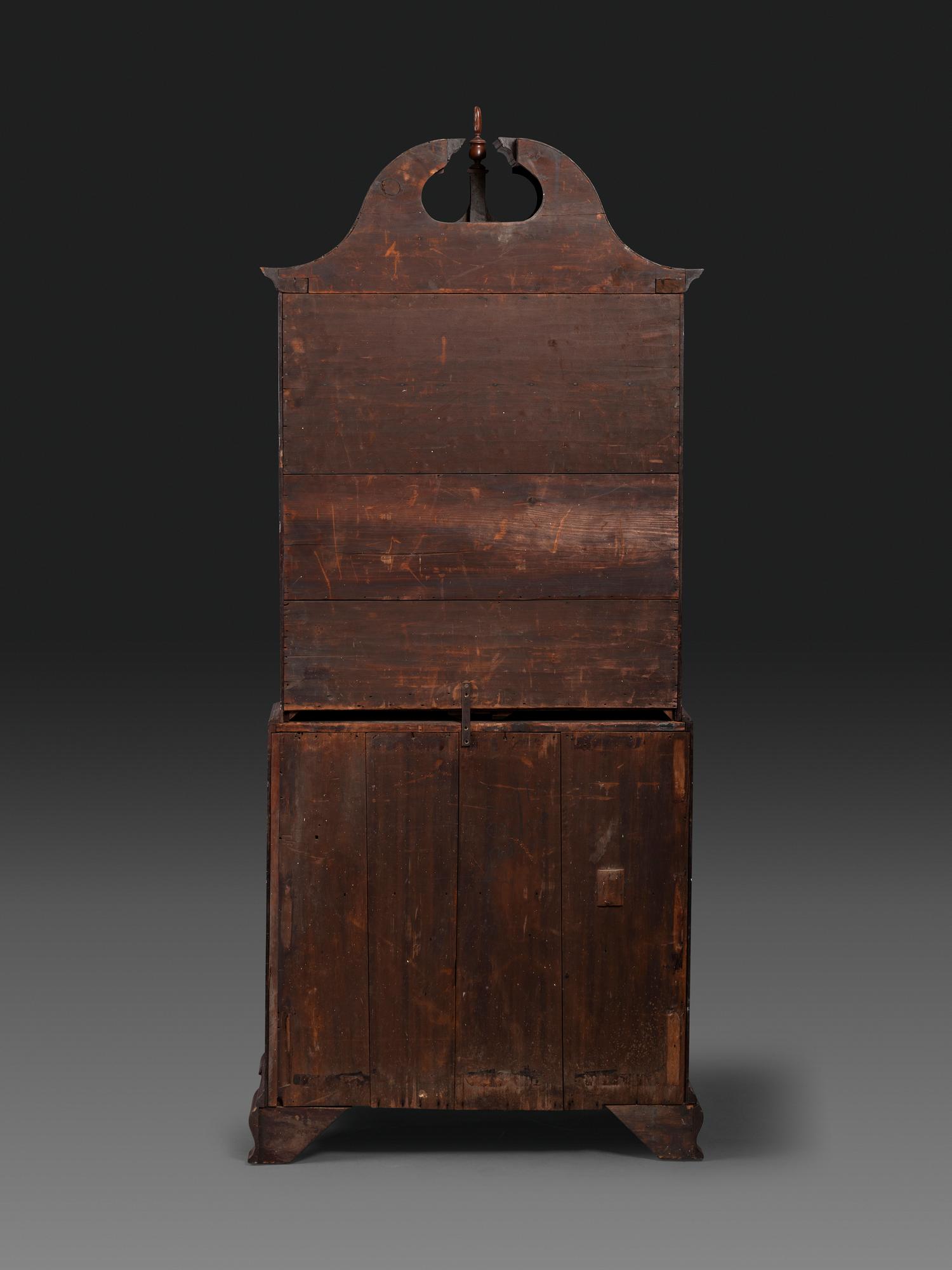 A Chippendale Figured Mahogany Bonnet Top Desk-and-Bookcase
