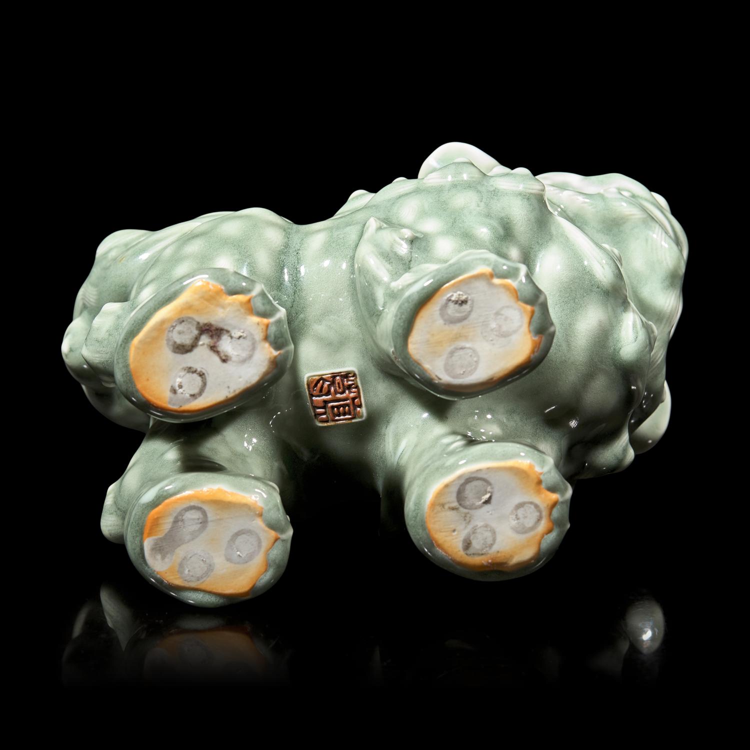A Japanese Celadon-Glazed Monju on Lion, Impressed Seal Makuzu