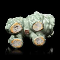 A Japanese Celadon-Glazed Monju on Lion, Impressed Seal Makuzu