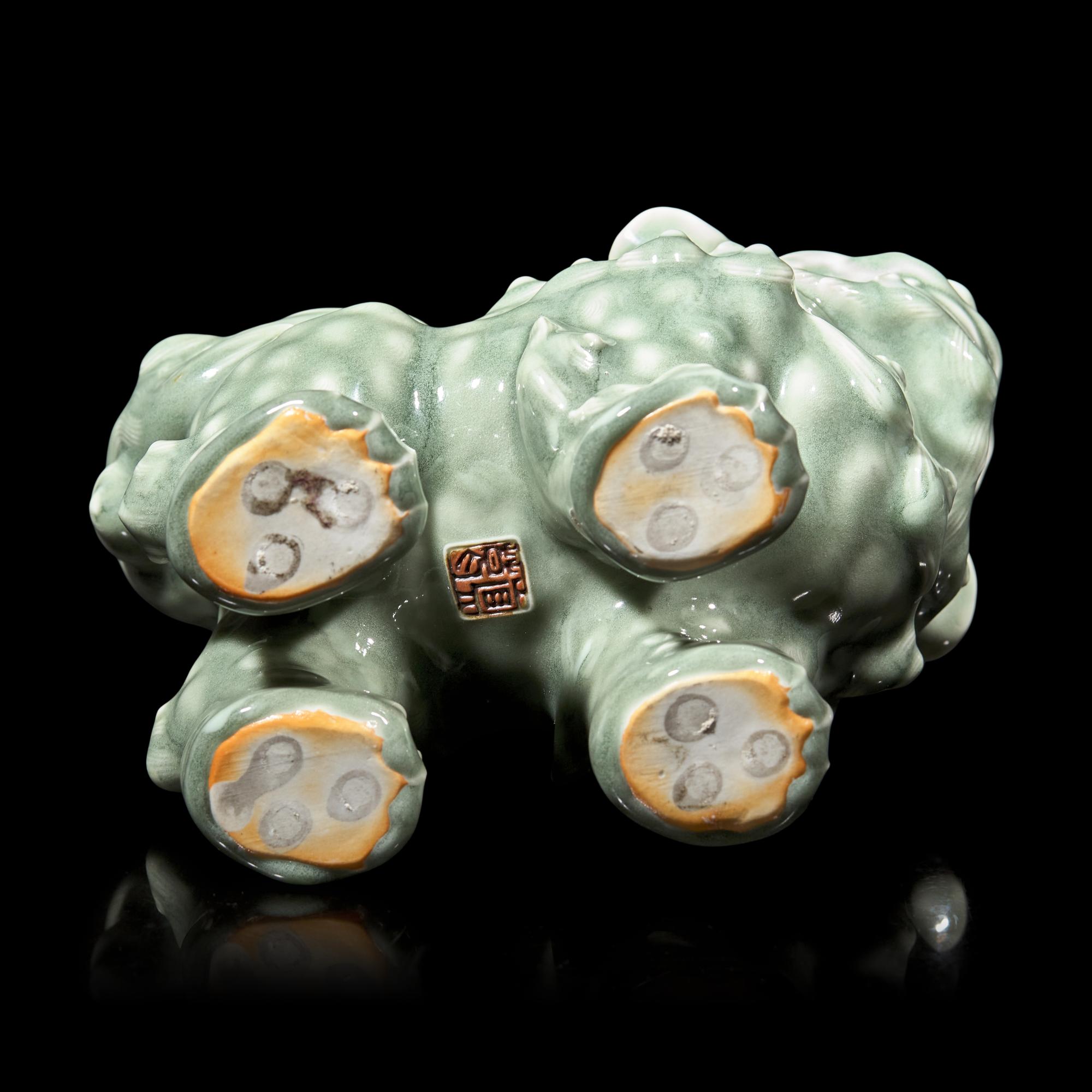 A Japanese Celadon-Glazed Monju on Lion, Impressed Seal Makuzu