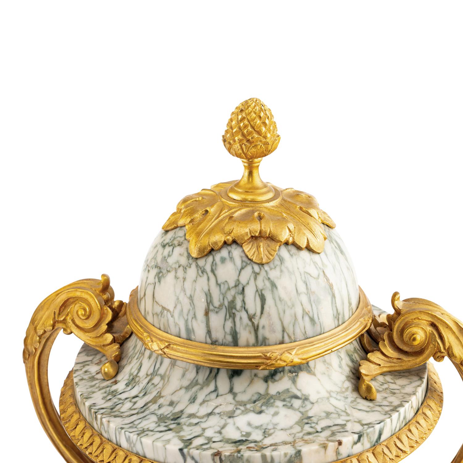 A Pair of Louis XVI Style Marble and Gilt Bronze Mounted Urns