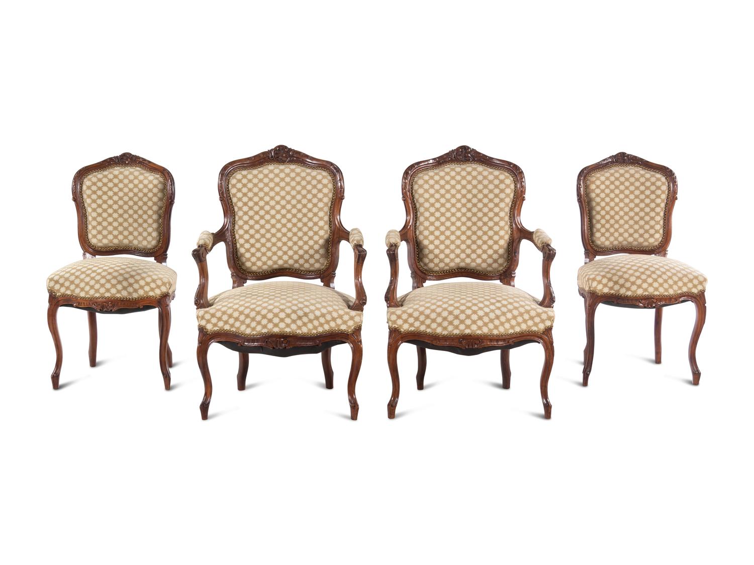 A Set of Four Louis XV Style Carved Walnut Chairs