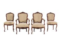 A Set of Four Louis XV Style Carved Walnut Chairs