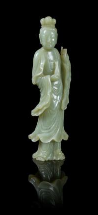 A Celadon Jade Figure of Guanyin POSSIBLY 19TH CENTURY Height 9 inches. — POSSIBLY 19TH CENTURY