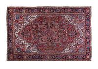 A Sarouk Wool Rug 10 feet 11 inches x 7 feet 7 inches.