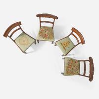A group of four Regency carved mahogany side chairs circa 1810-1820