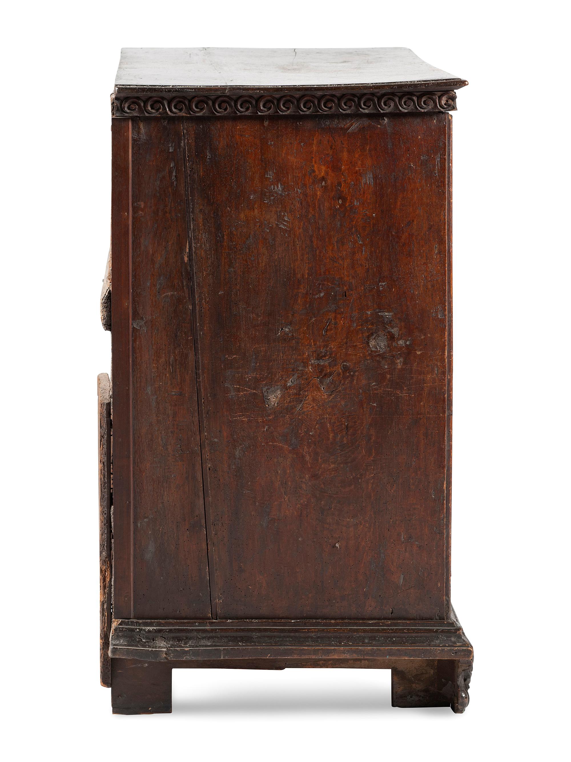 A Baroque Highly Carved Walnut Commode