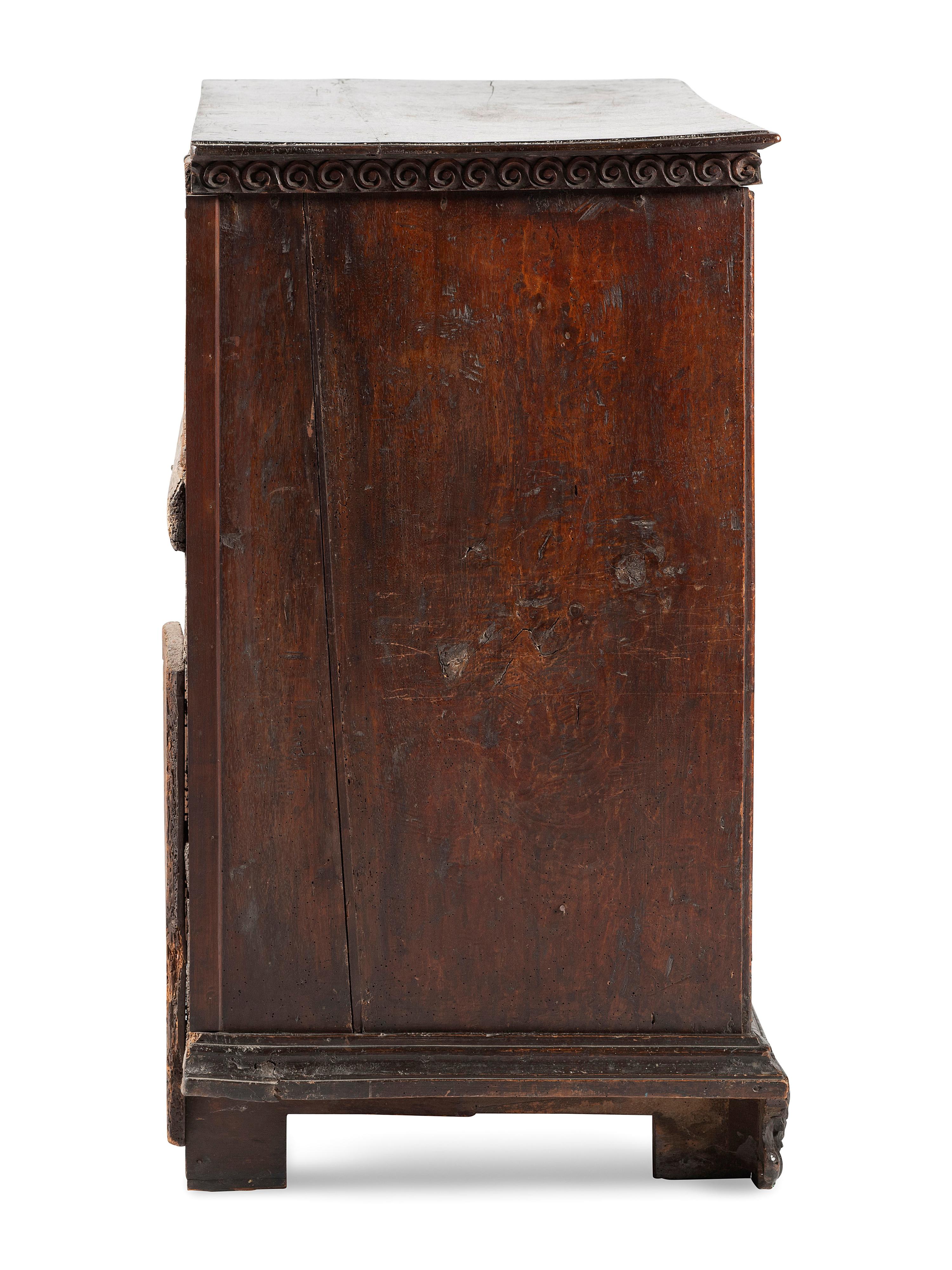 A Baroque Highly Carved Walnut Commode
