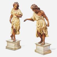 A pair of Italian carved and polychromed wood figures of young men 18th century