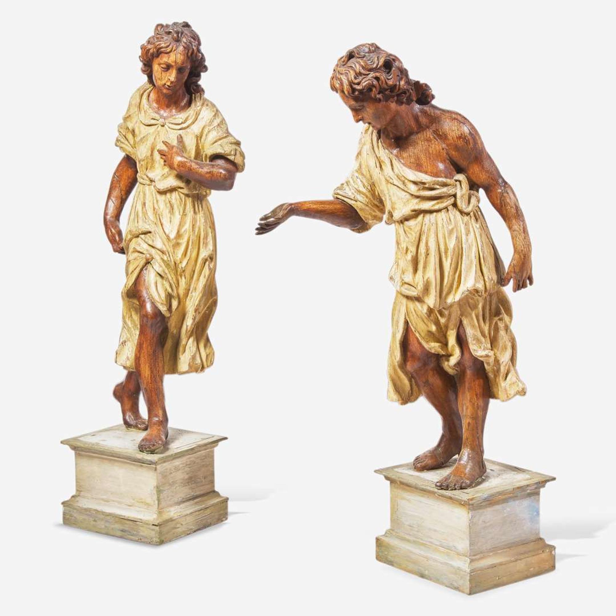 A pair of Italian carved and polychromed wood figures of young men 18th century
