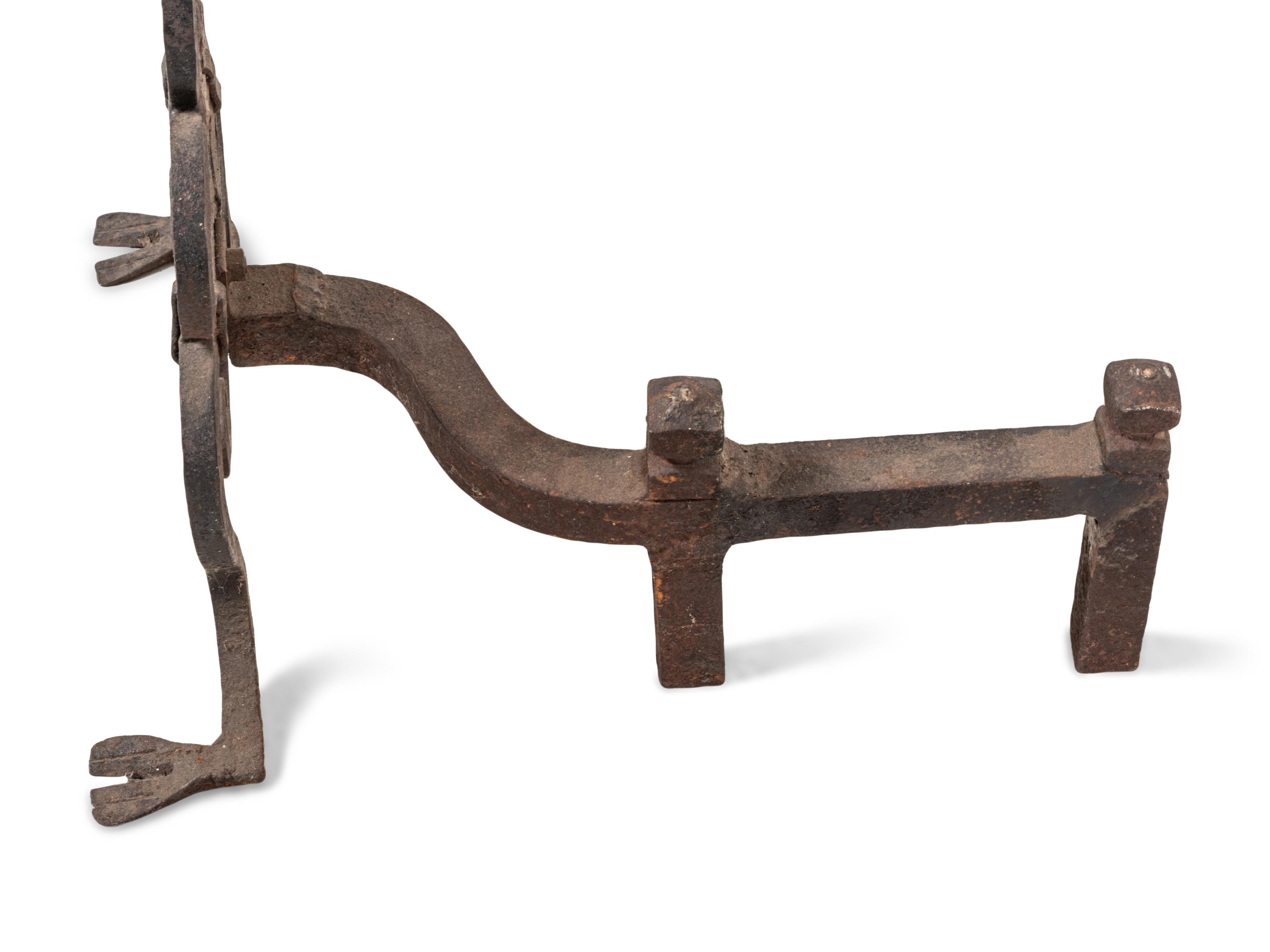 A Pair of Continental Iron Fleur-de-Lis Andirons
