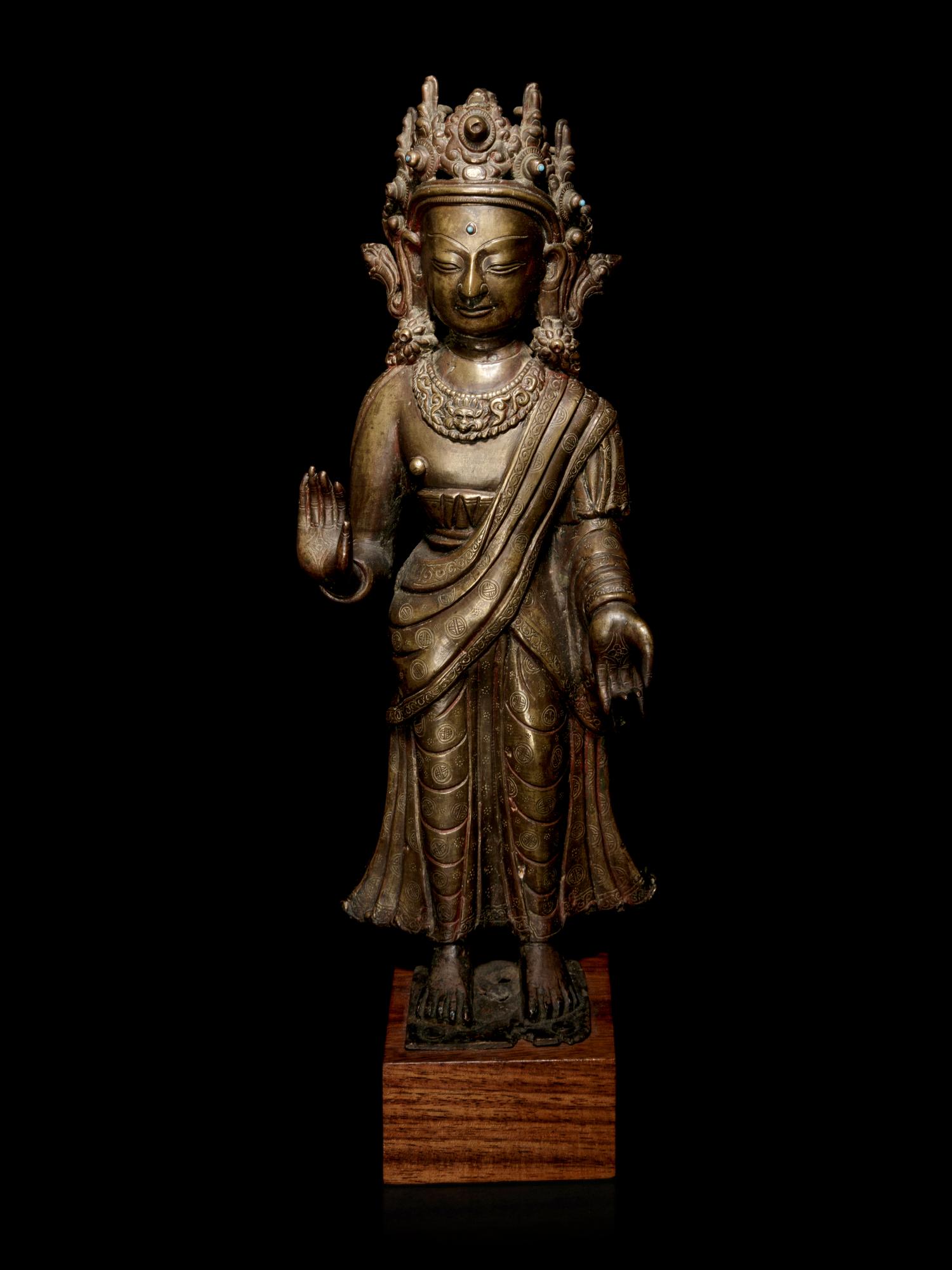 A Large Tibetan Gilt Bronze Figure of Buddha Dipankara