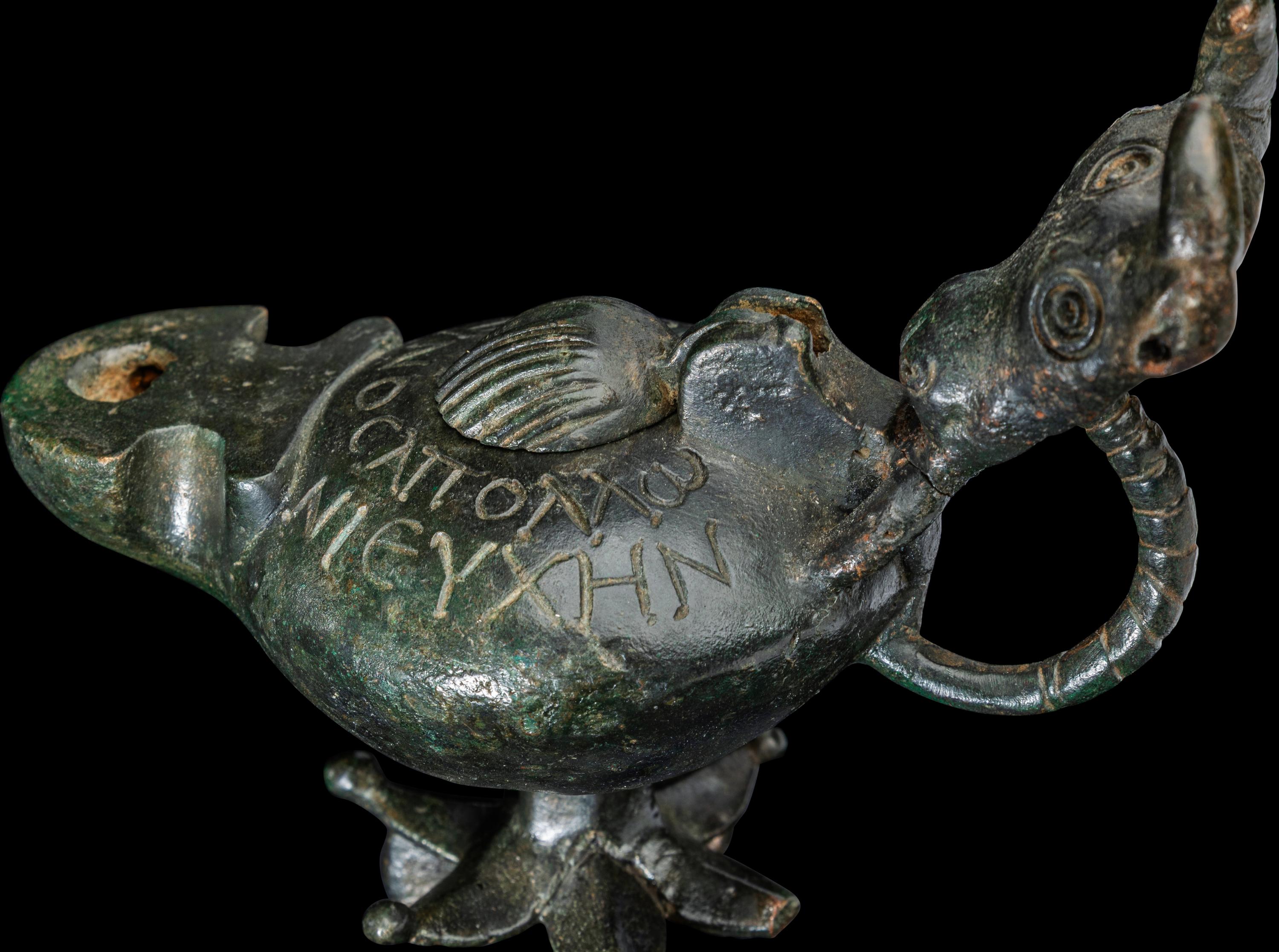 A Late Roman Bronze Lamp with Bull Head Handle and Greek Inscription
