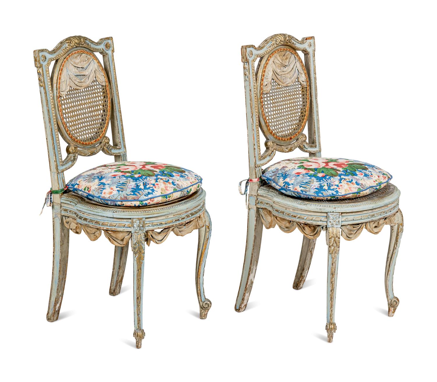 A Pair of Louis XVI Style Painted and Parcel-Gilt Chaises