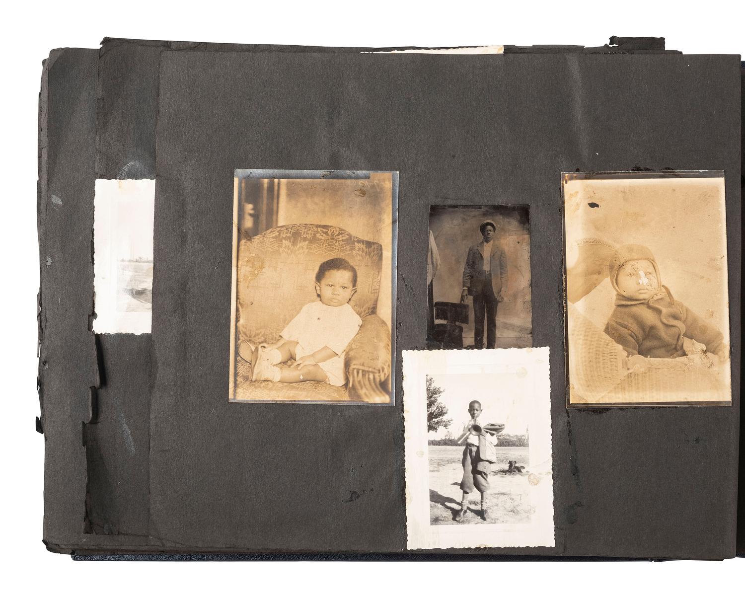 [EARLY PHOTOGRAPHY]. Album containing photos of a multi-generational African American family in Washington, DC. Ca early-to-mid 20th Century.