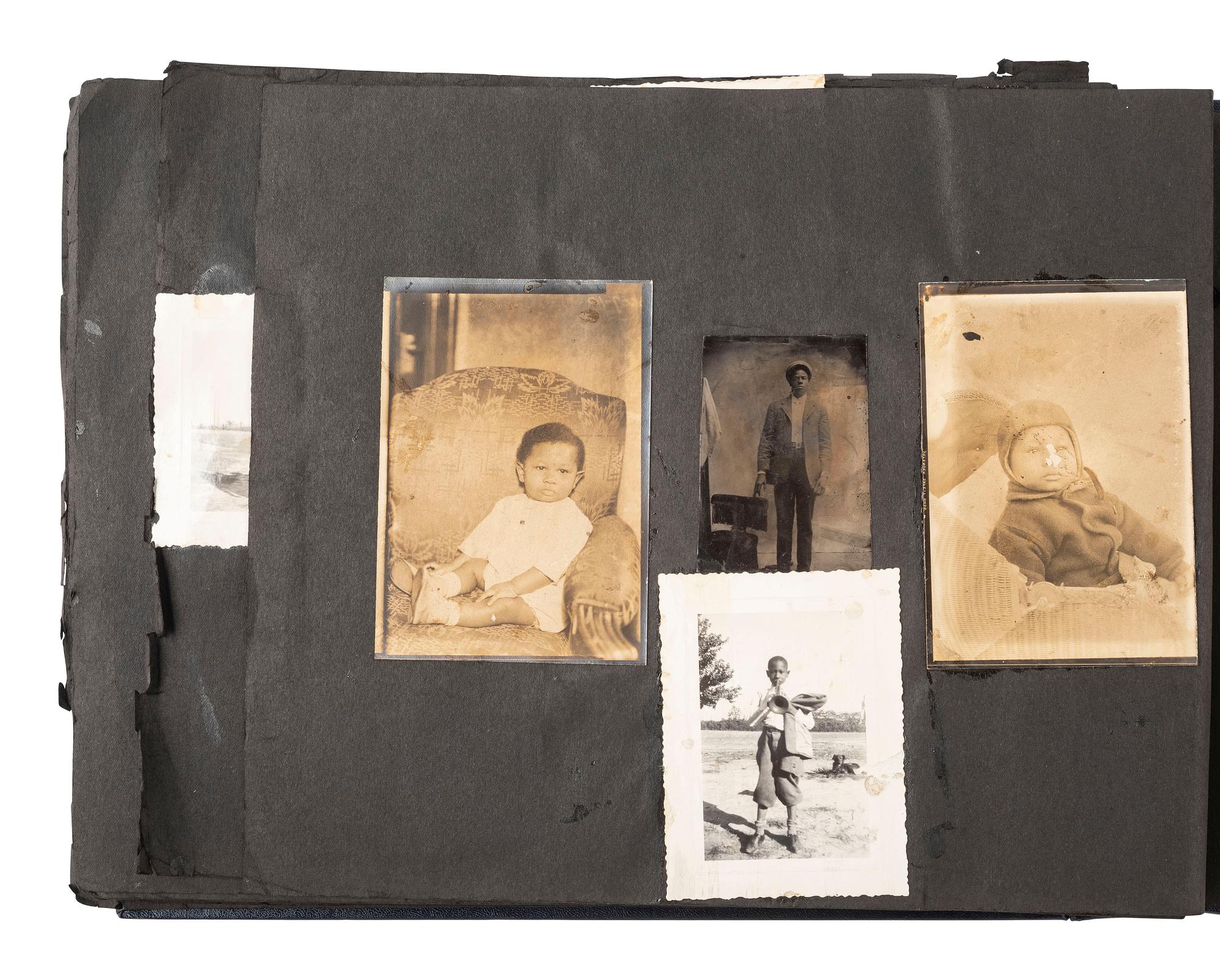 [EARLY PHOTOGRAPHY]. Album containing photos of a multi-generational African American family in Washington, DC. Ca early-to-mid 20th Century.