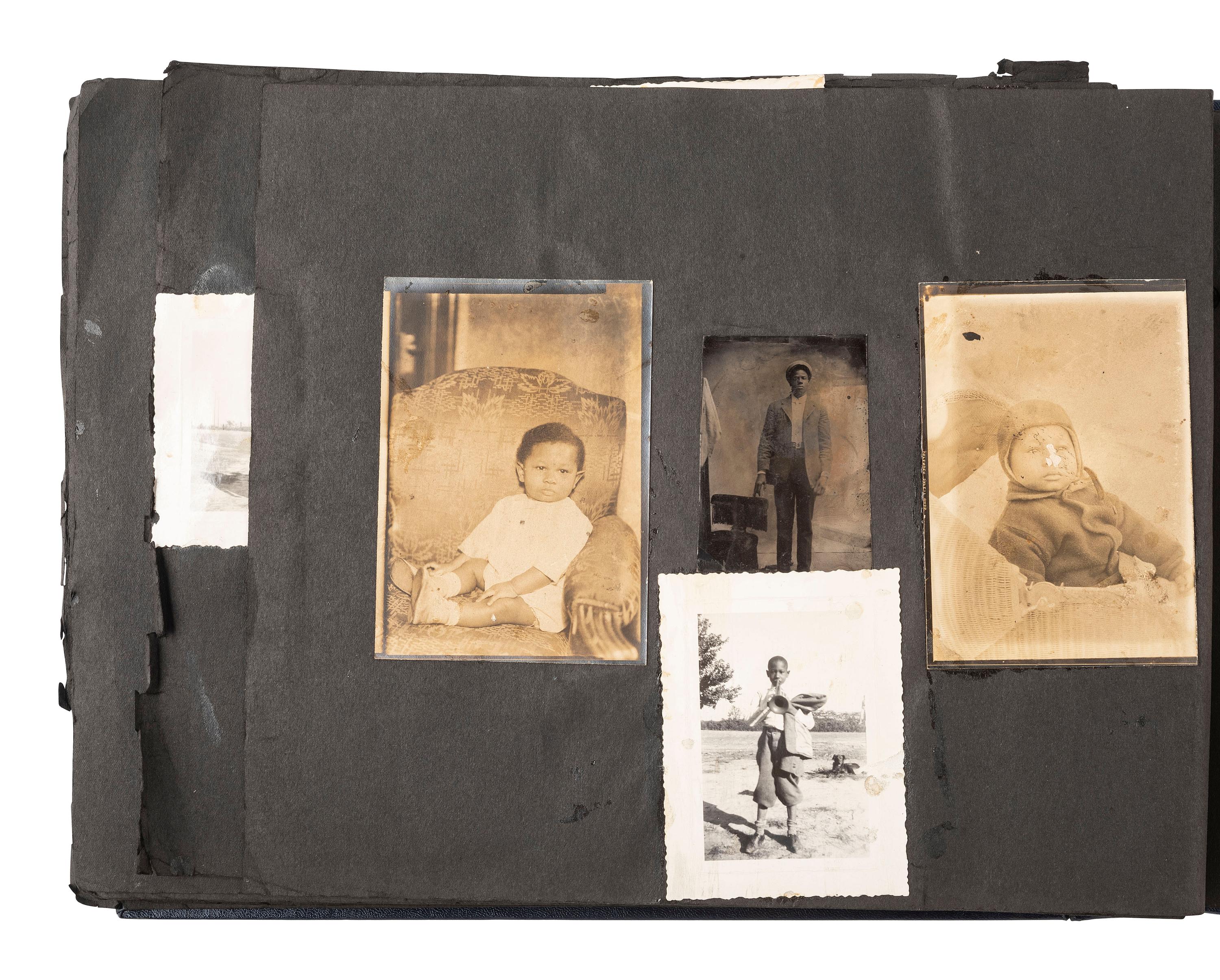 [EARLY PHOTOGRAPHY]. Album containing photos of a multi-generational African American family in Washington, DC. Ca early-to-mid 20th Century.